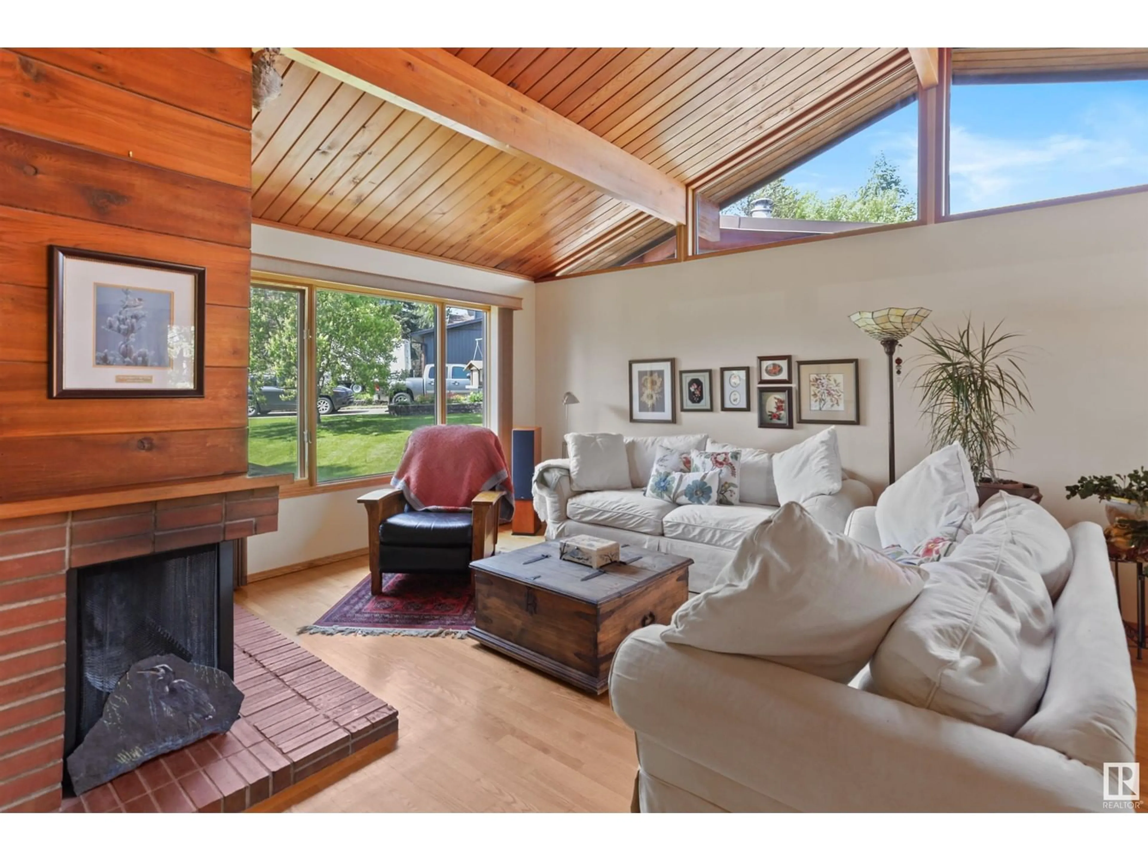 Living room with furniture, wood/laminate floor for 17 CLEARWATER CR, Devon Alberta T9G1C8