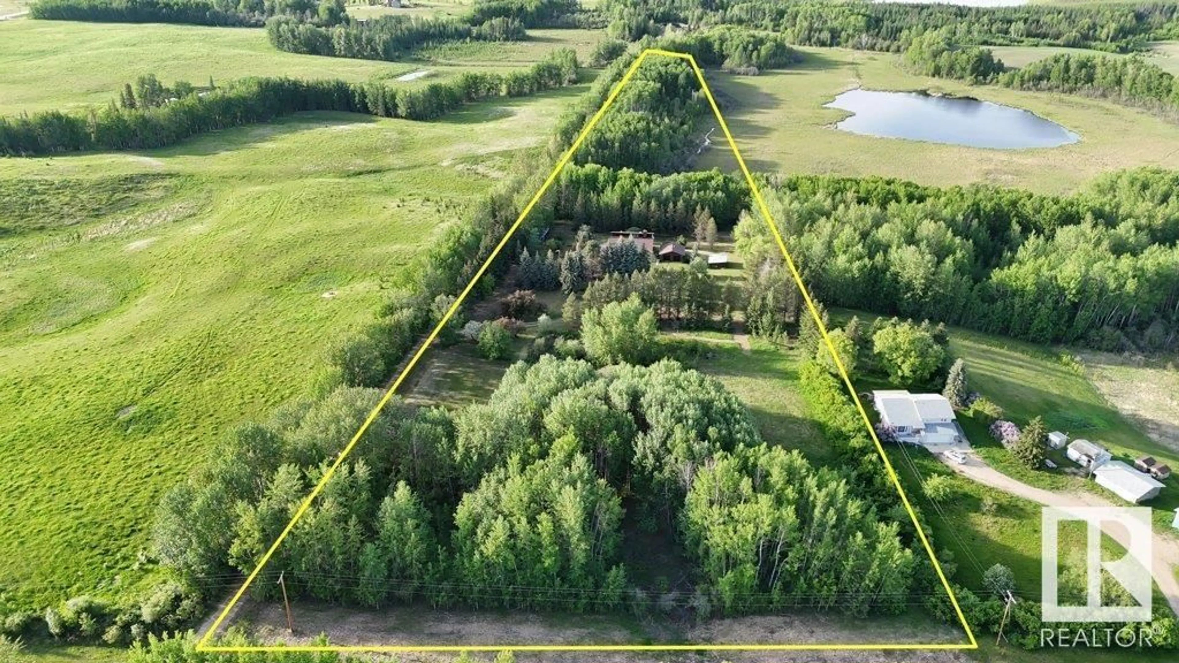 A pic from outside/outdoor area/front of a property/back of a property/a pic from drone, unknown for 60519 RANGE ROAD 55A, Rural Barrhead County Alberta T0G2G0