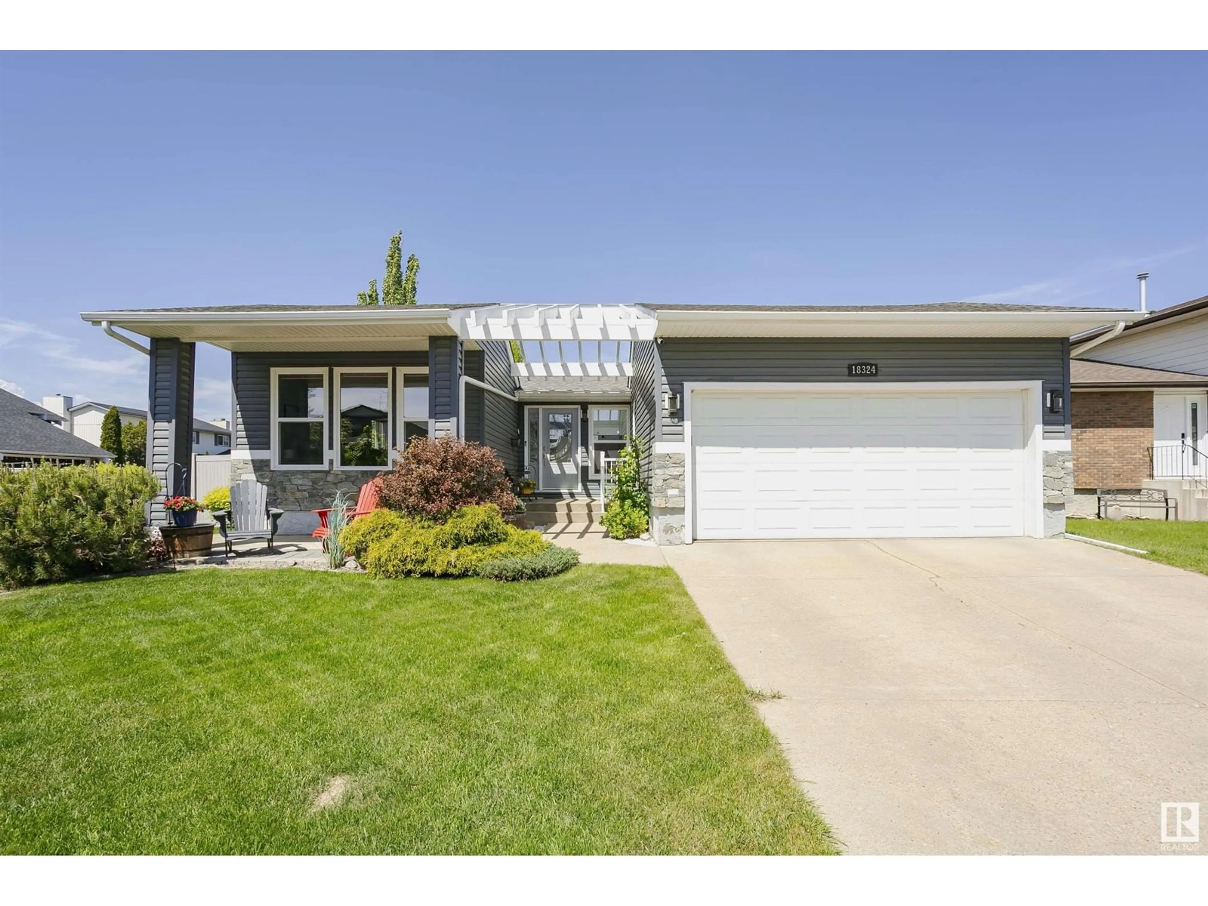 Home with vinyl exterior material, street for 18324 77 AV, Edmonton Alberta T5T2G4