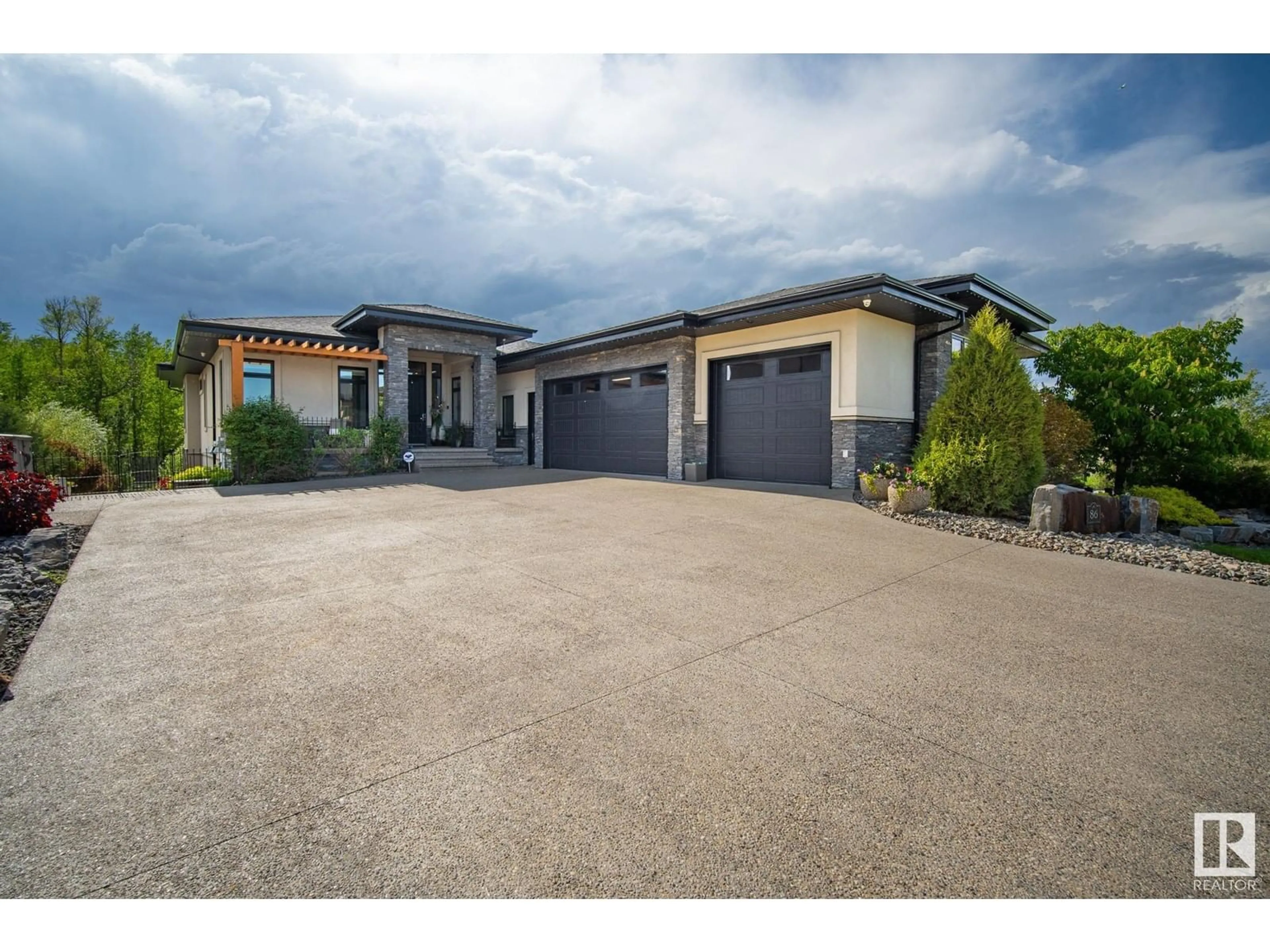 A pic from outside/outdoor area/front of a property/back of a property/a pic from drone, street for #86 - 52320 RGE ROAD 231, Rural Strathcona County Alberta T8B1A9