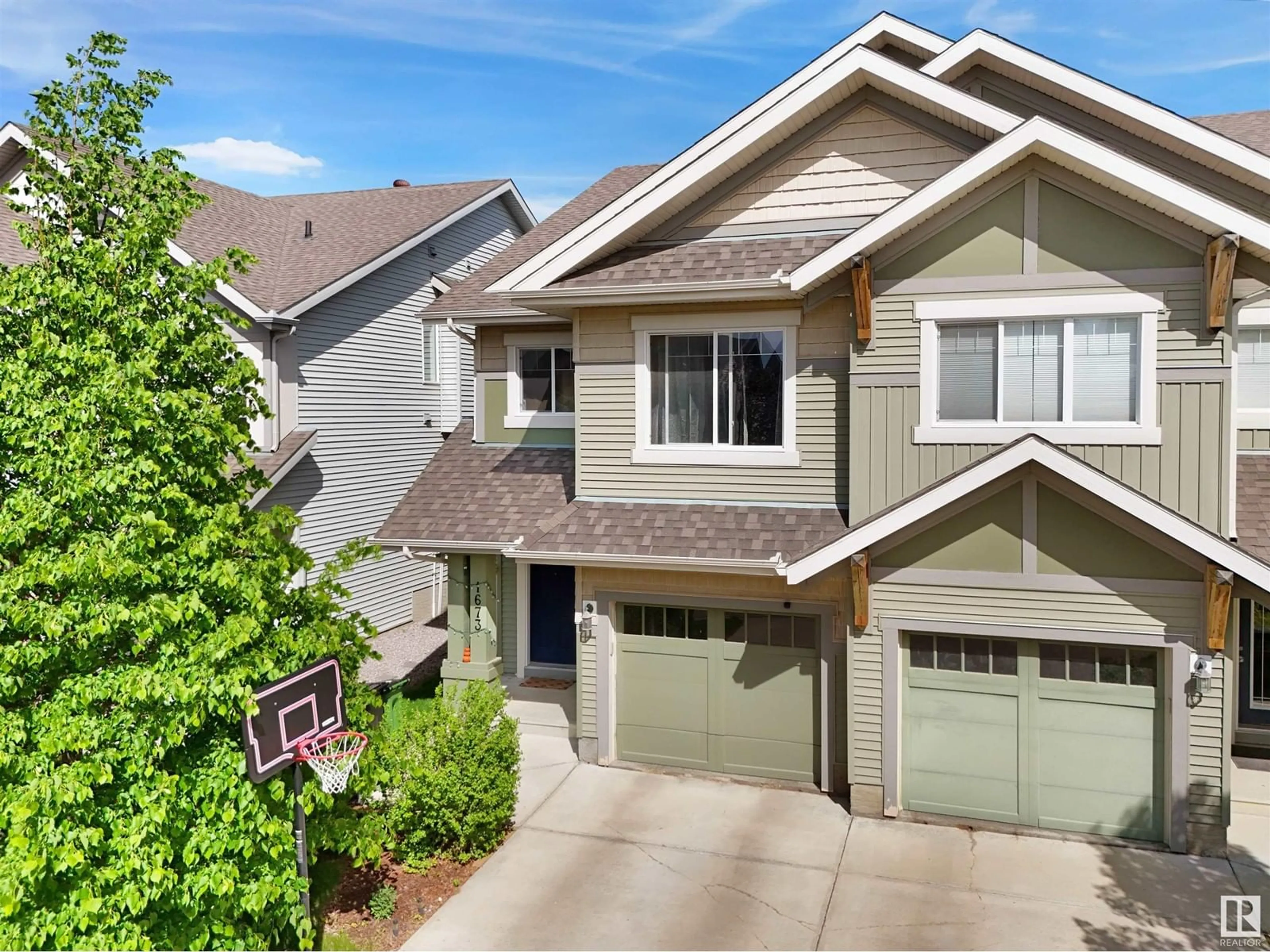 Home with vinyl exterior material, street for 1673 CHAPMAN WY, Edmonton Alberta T6W0Y5