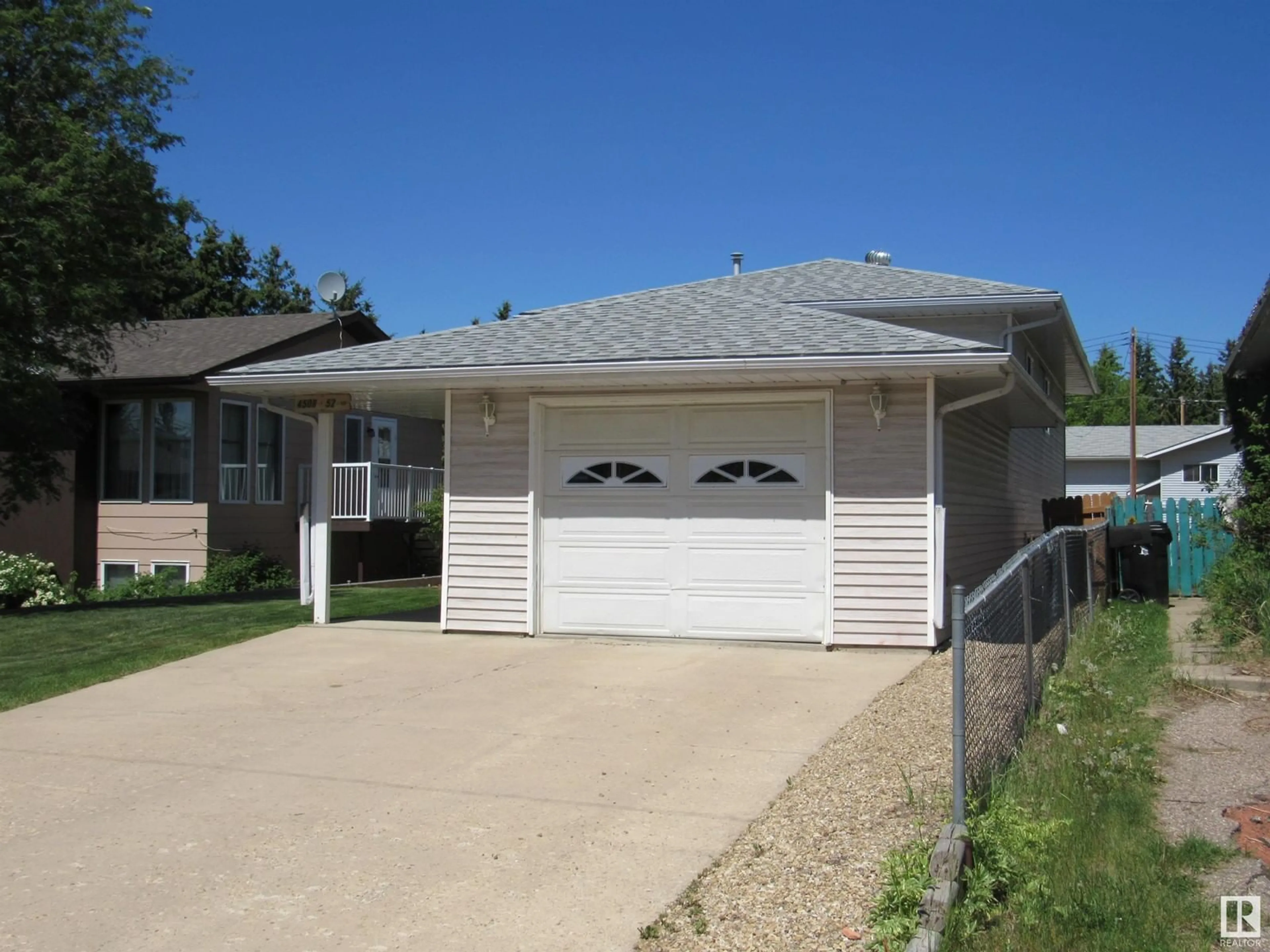 Home with vinyl exterior material, street for 4508 52 AV, Barrhead Alberta T7N1J1