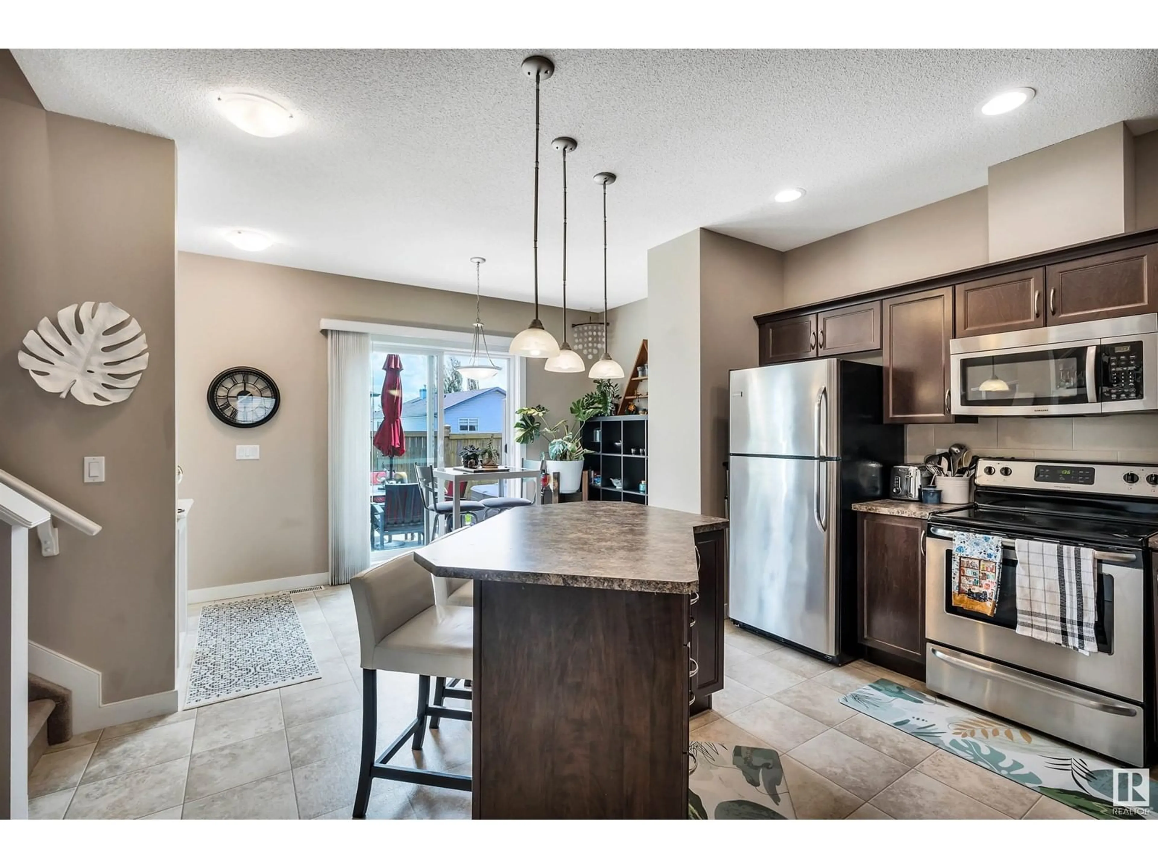 Open concept kitchen, ceramic/tile floor for 5 - 13825 155 AV, Edmonton Alberta T6V0B8