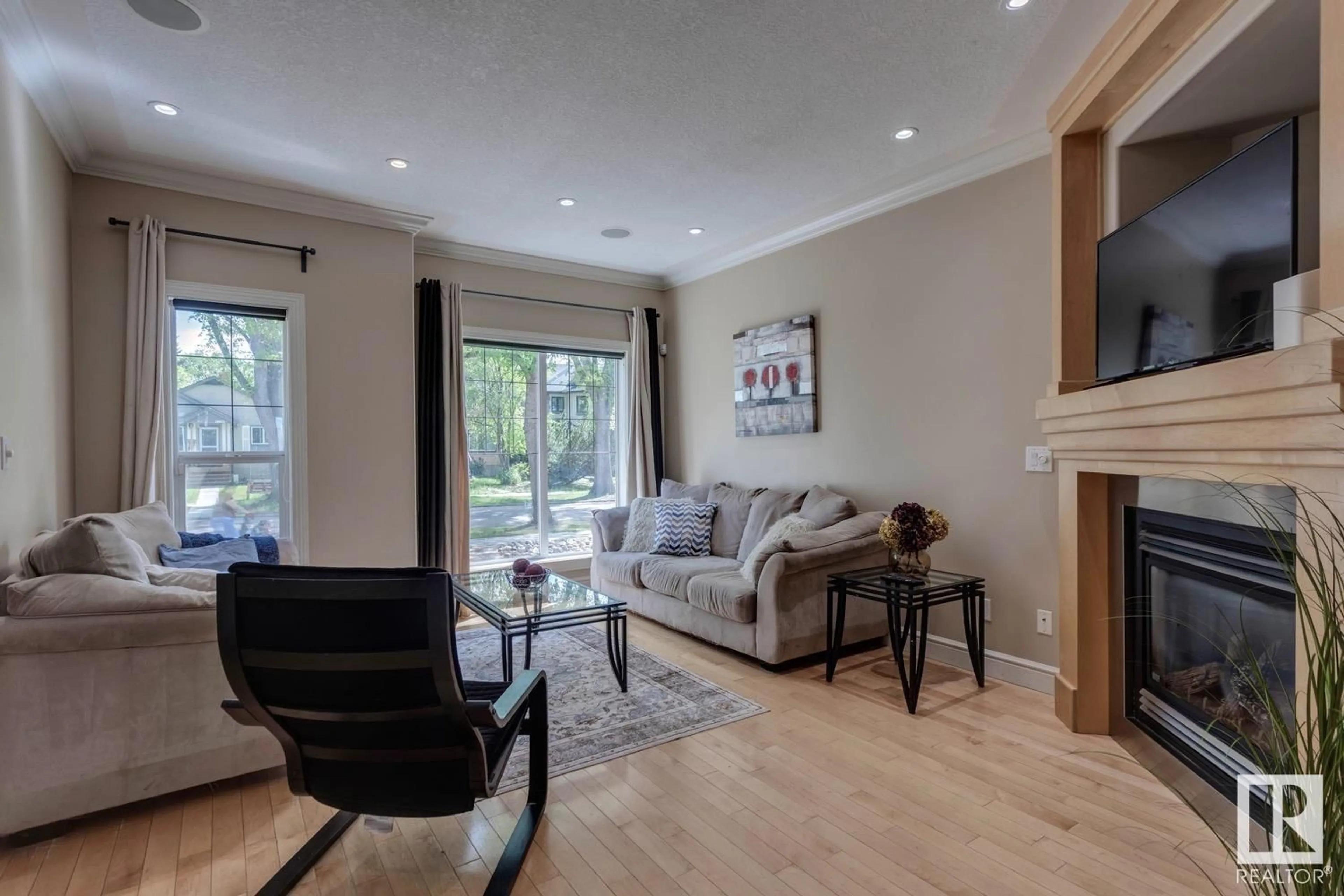 Living room with furniture, wood/laminate floor for 10816 64 AV, Edmonton Alberta T6H1T2