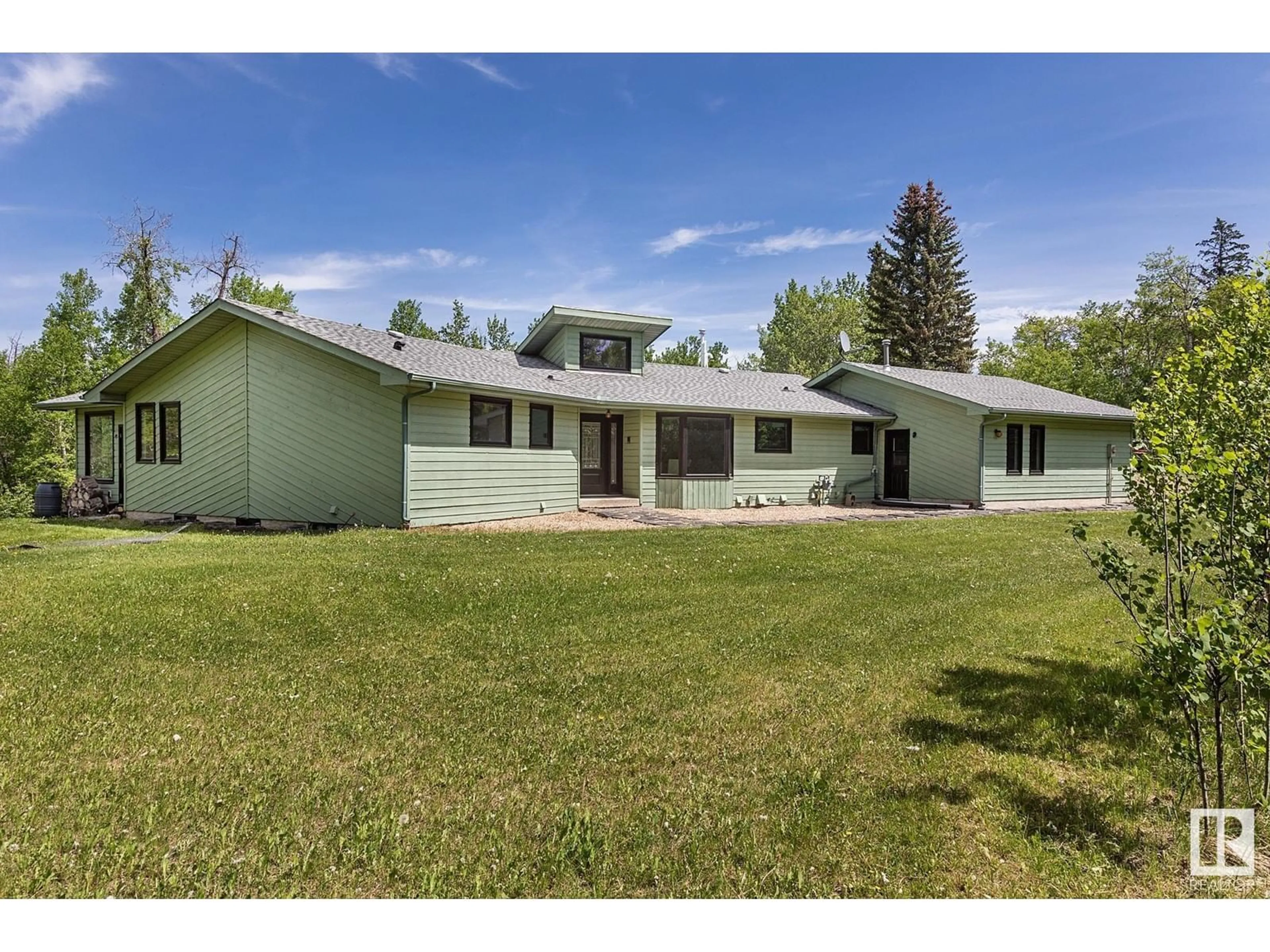 A pic from outside/outdoor area/front of a property/back of a property/a pic from drone, unknown for 38 22430 TWP RD 520, Rural Strathcona County Alberta T8C1E6