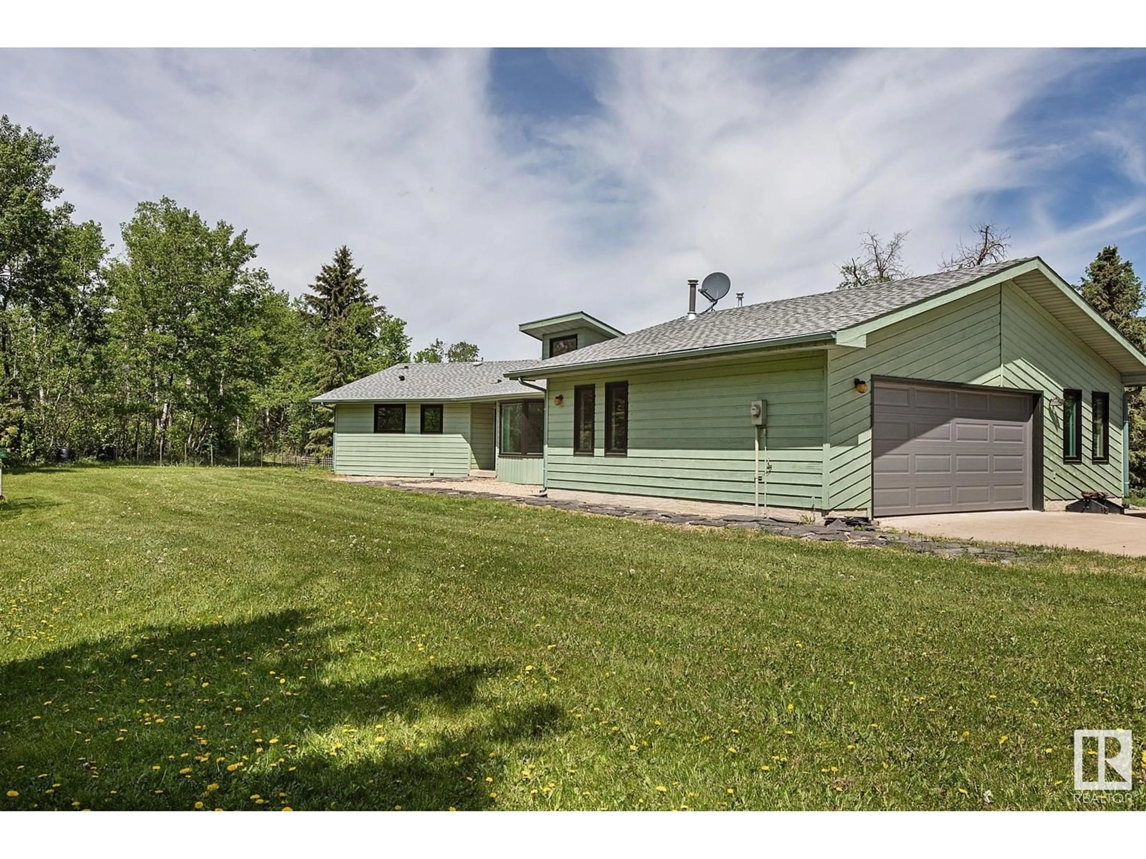 A pic from outside/outdoor area/front of a property/back of a property/a pic from drone, unknown for 38 22430 TWP RD 520, Rural Strathcona County Alberta T8C1E6