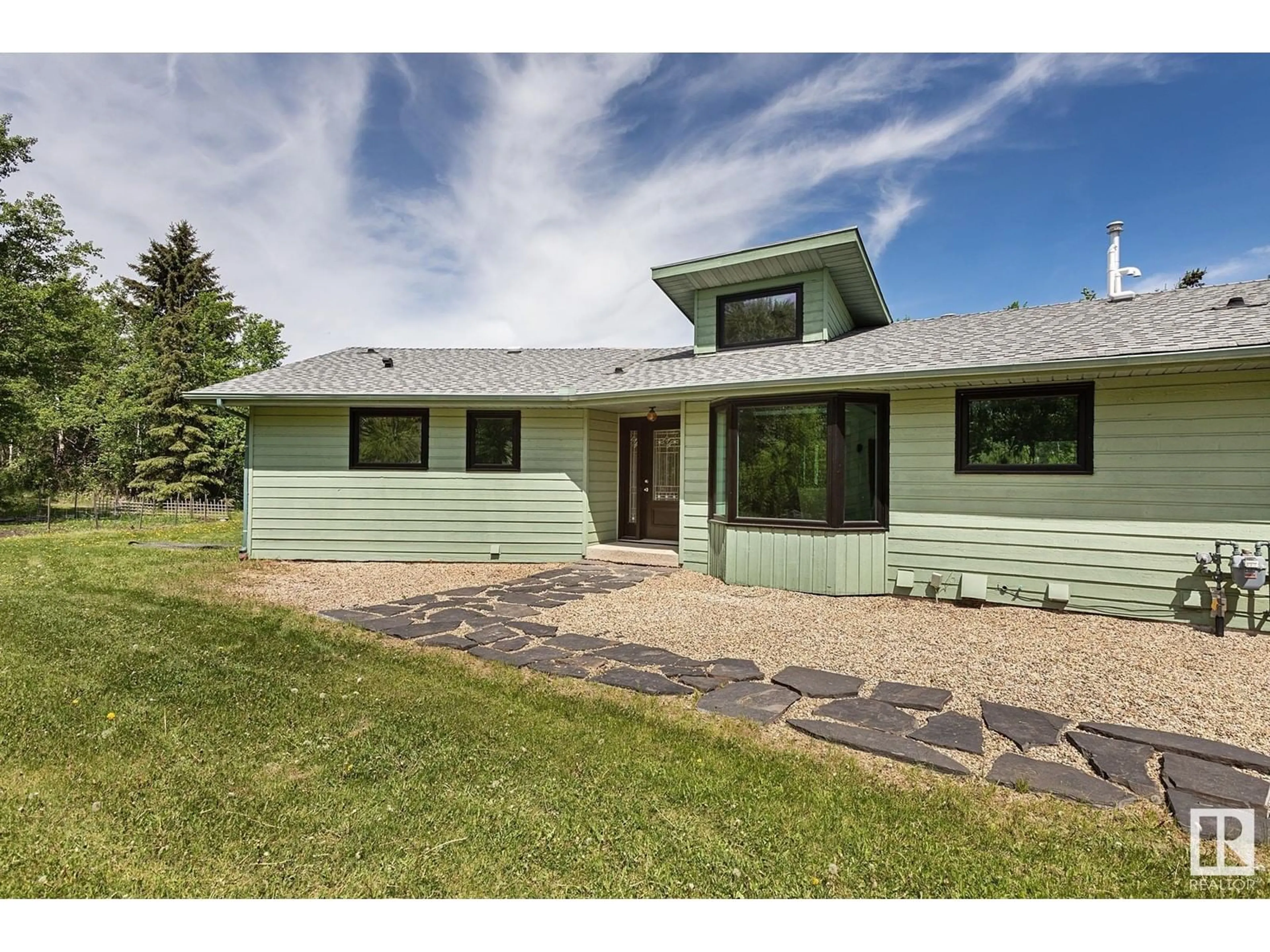 Home with vinyl exterior material, street for 38 22430 TWP RD 520, Rural Strathcona County Alberta T8C1E6