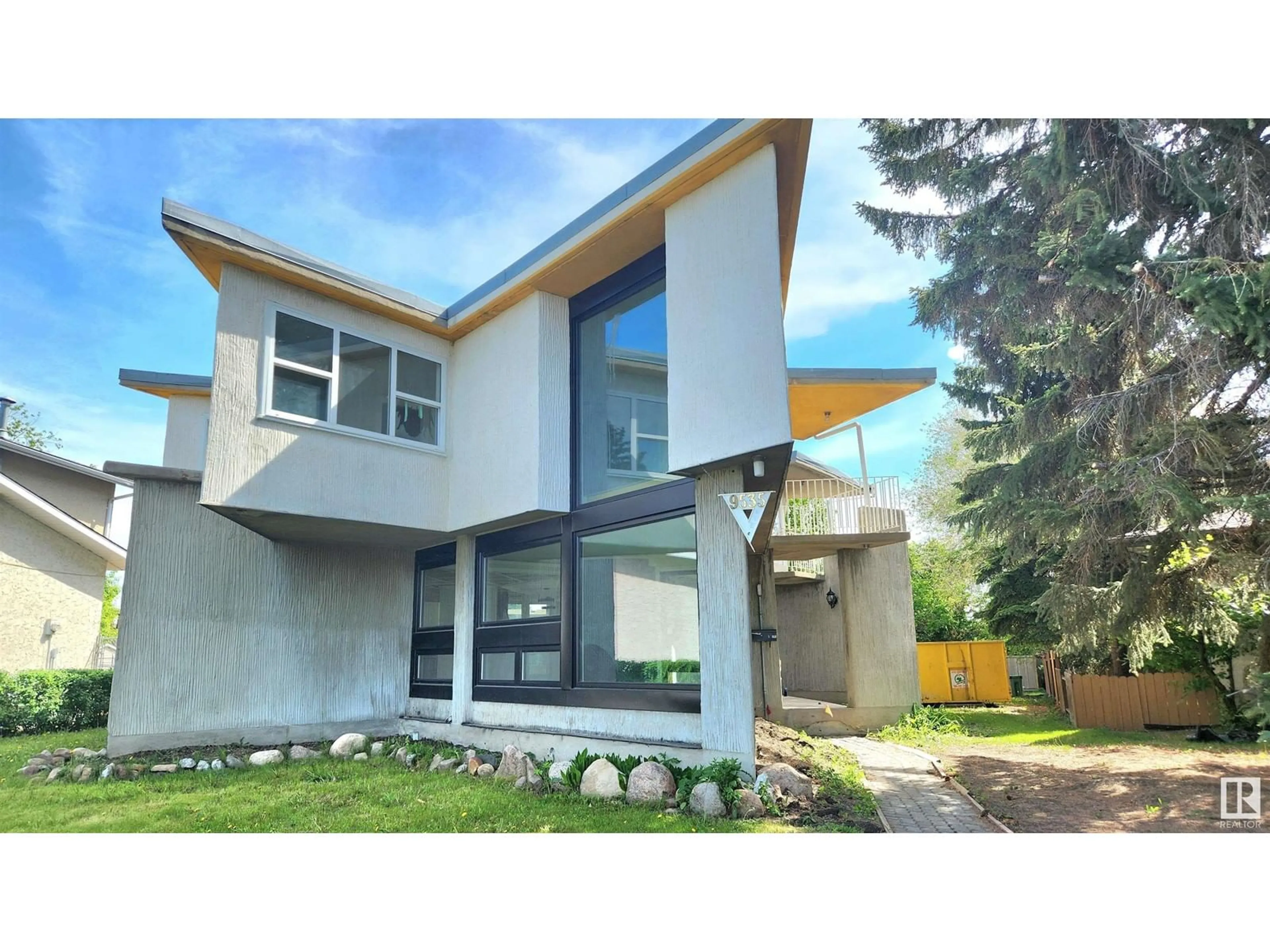 Home with vinyl exterior material, street for NW - 9535 147 AV, Edmonton Alberta T5E2K5