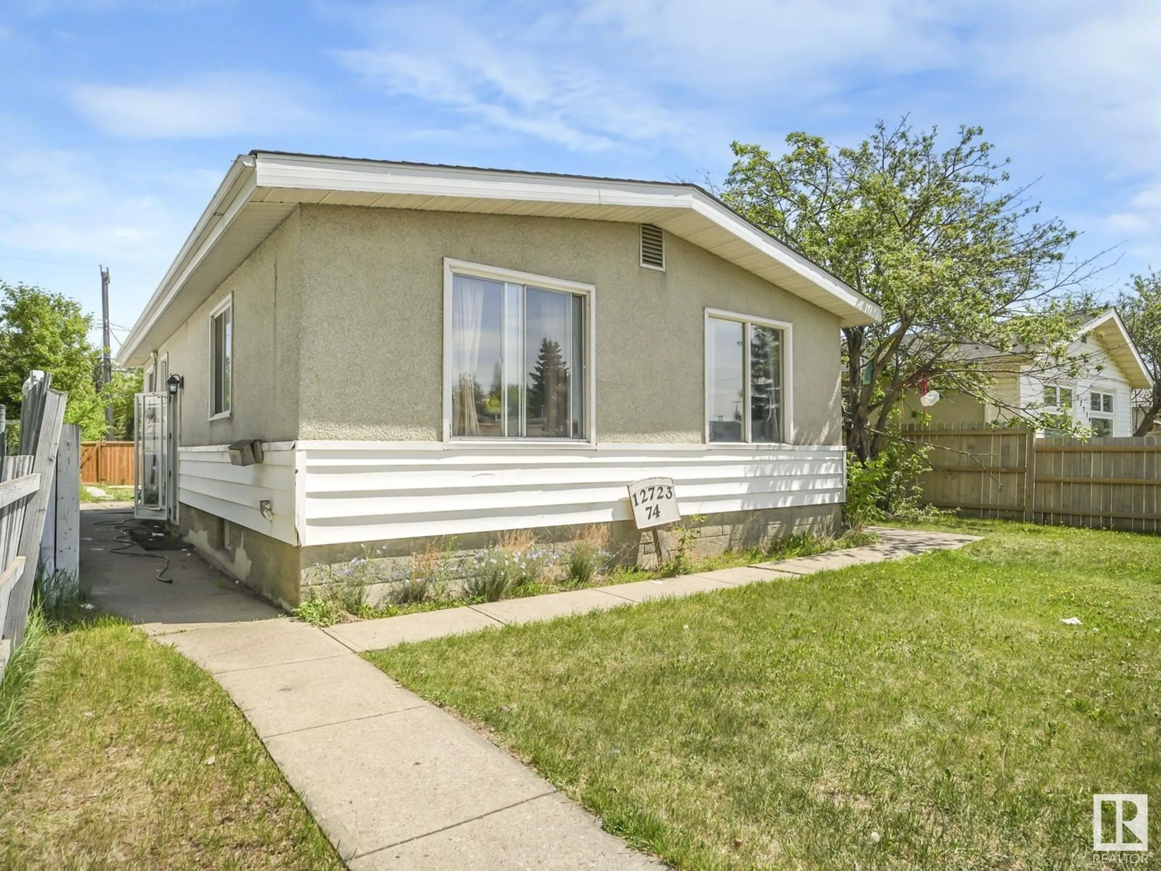 Home with vinyl exterior material, street for 12723 74 ST, Edmonton Alberta T5C0W8