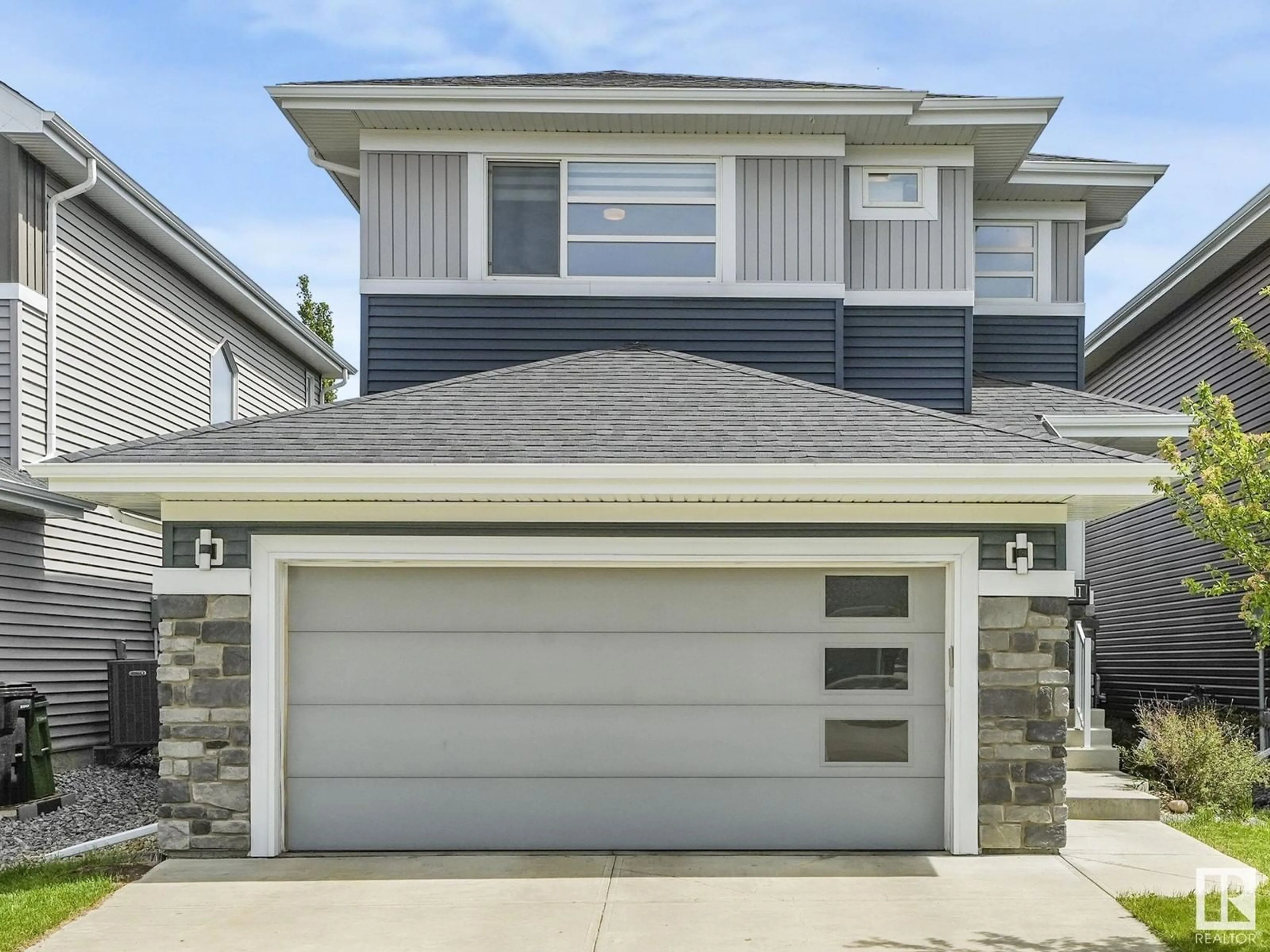 Home with vinyl exterior material, street for SW - 1611 168 ST, Edmonton Alberta T6W3R7