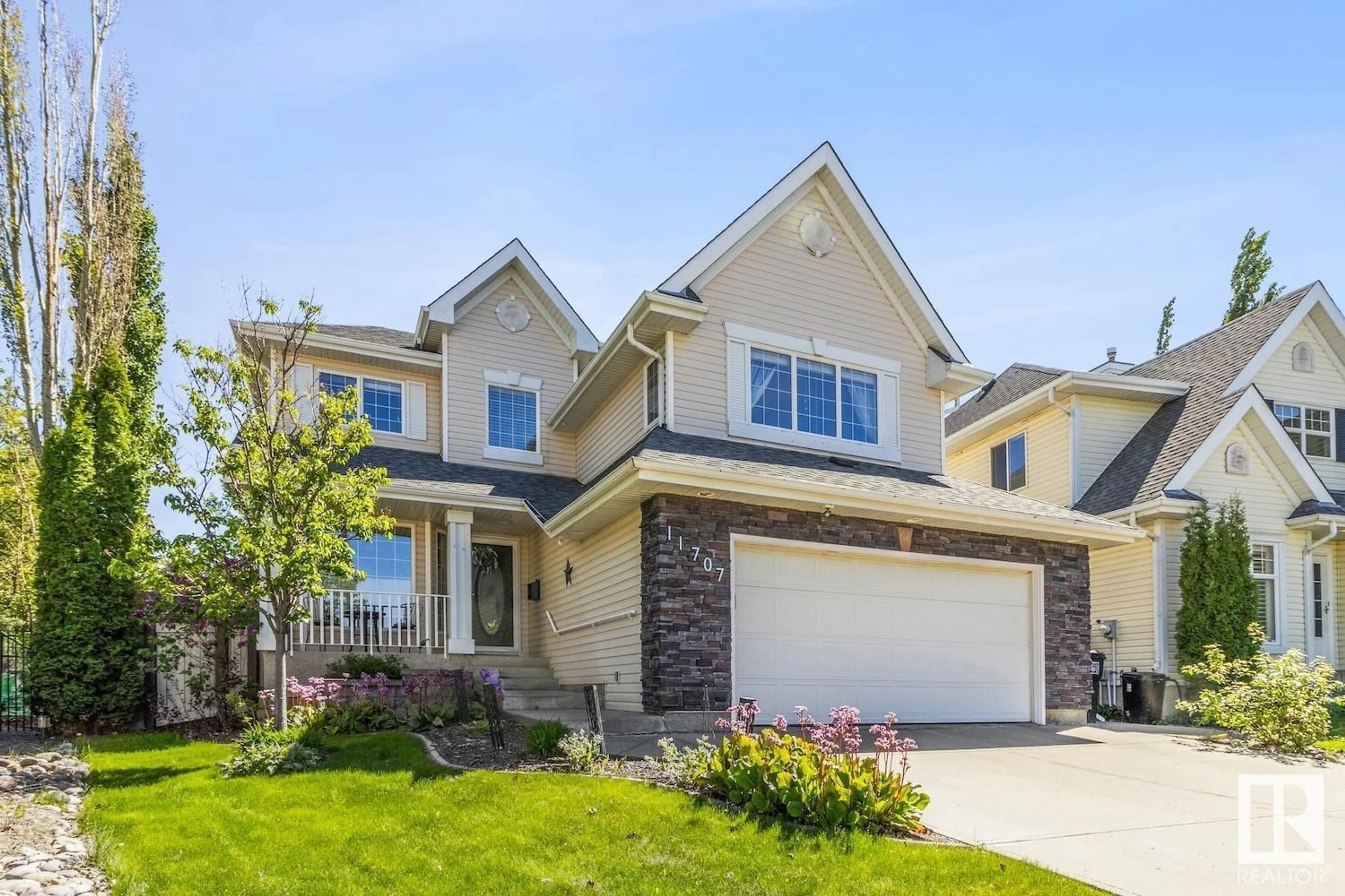 Home with vinyl exterior material, street for 11707 13 AV, Edmonton Alberta T6J7G1