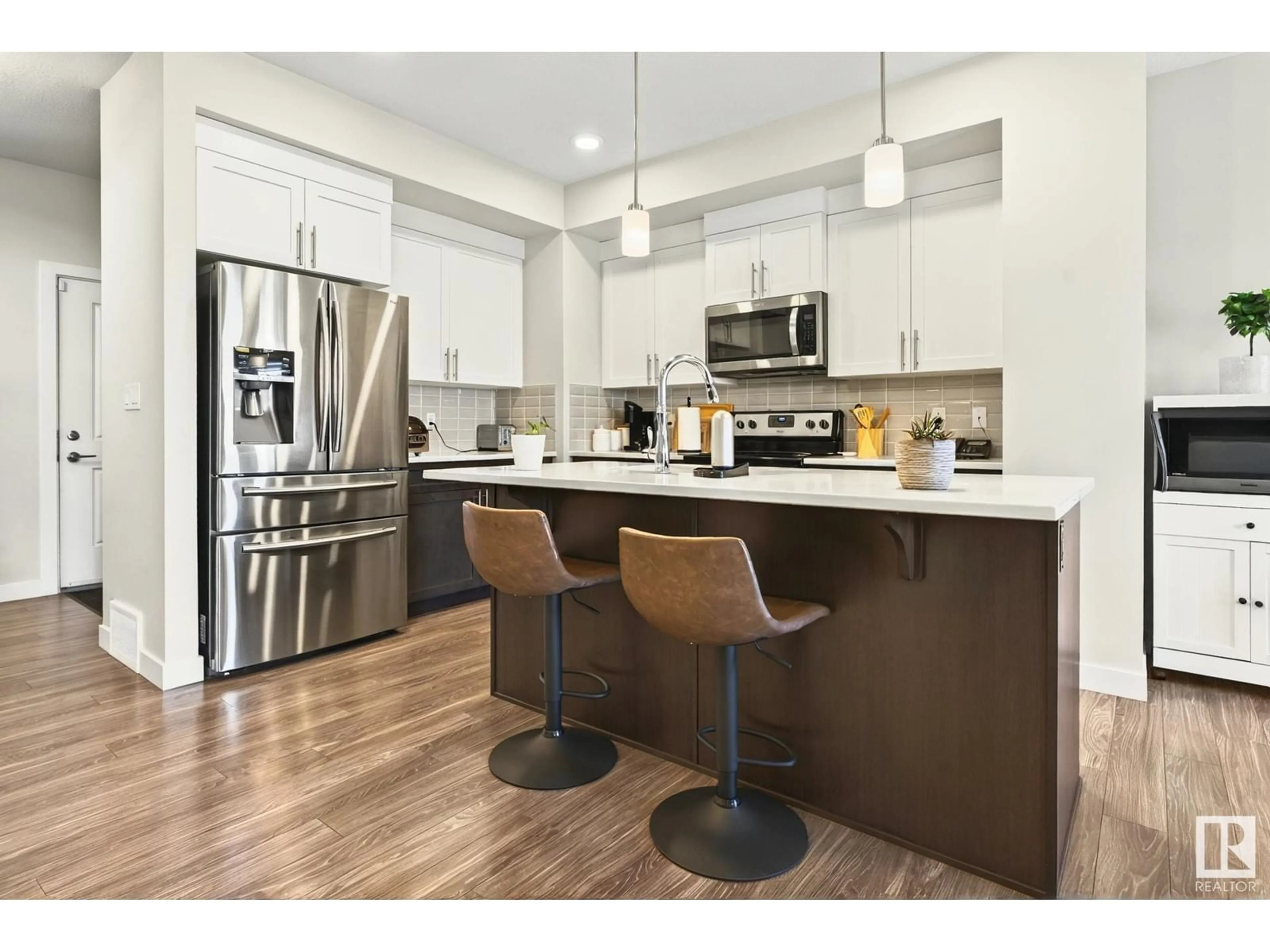 Open concept kitchen, wood/laminate floor for 1813 KEENE CR, Edmonton Alberta T6W3J8