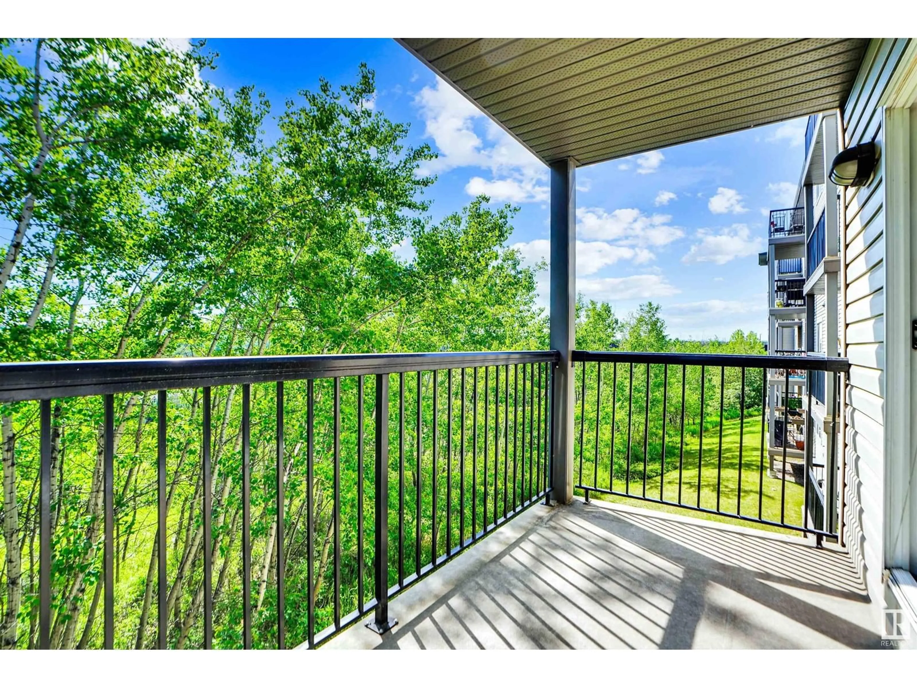 Patio, water/lake/river/ocean view for 207 - 1188 HYNDMAN RD, Edmonton Alberta T5A0E9