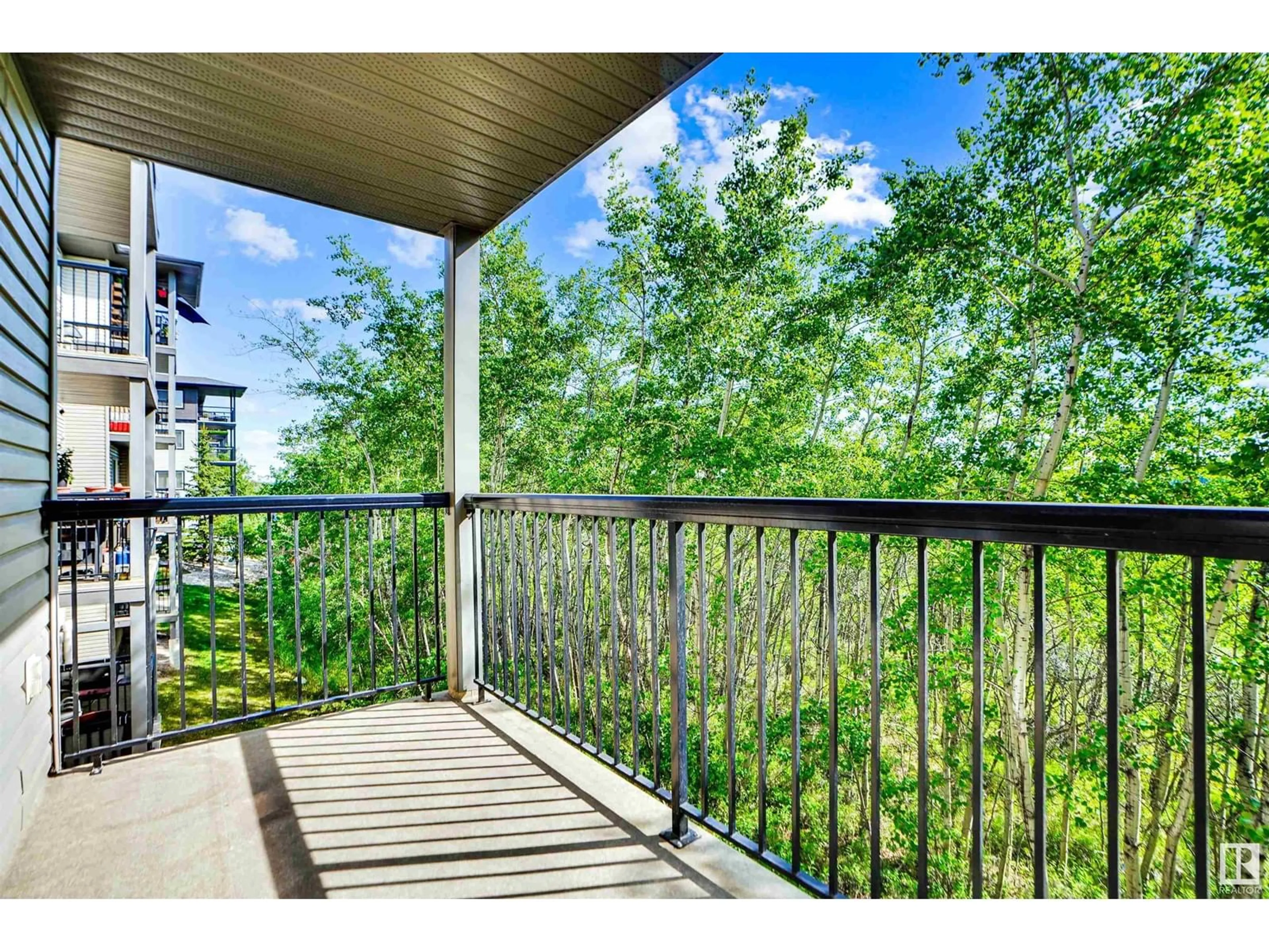 Patio, water/lake/river/ocean view for 207 - 1188 HYNDMAN RD, Edmonton Alberta T5A0E9