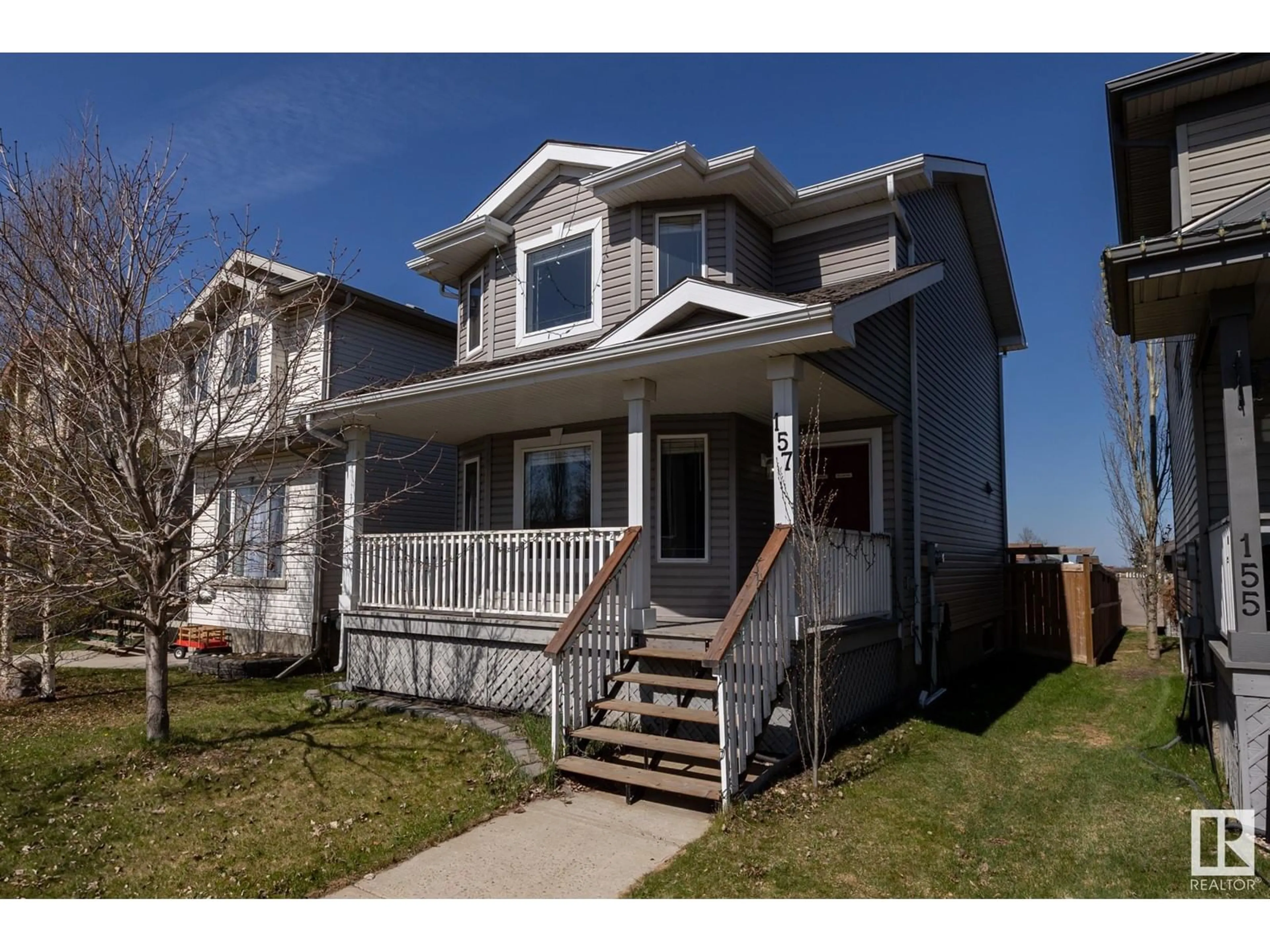 Home with vinyl exterior material, street for 157 BRIDGEPORT BV, Leduc Alberta T9E0H8