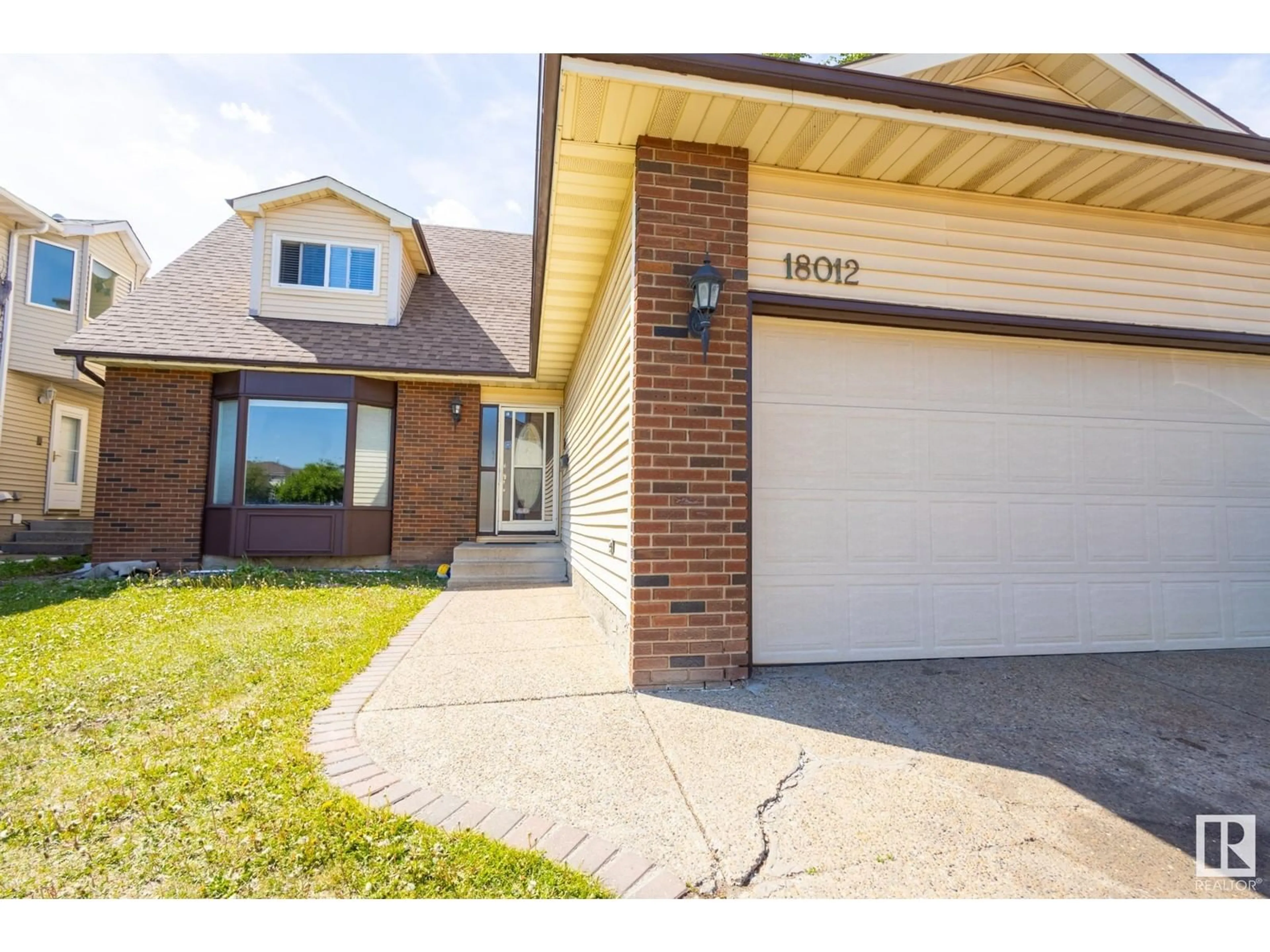 Home with brick exterior material, street for 18012 96 ST, Edmonton Alberta T5Z2G5