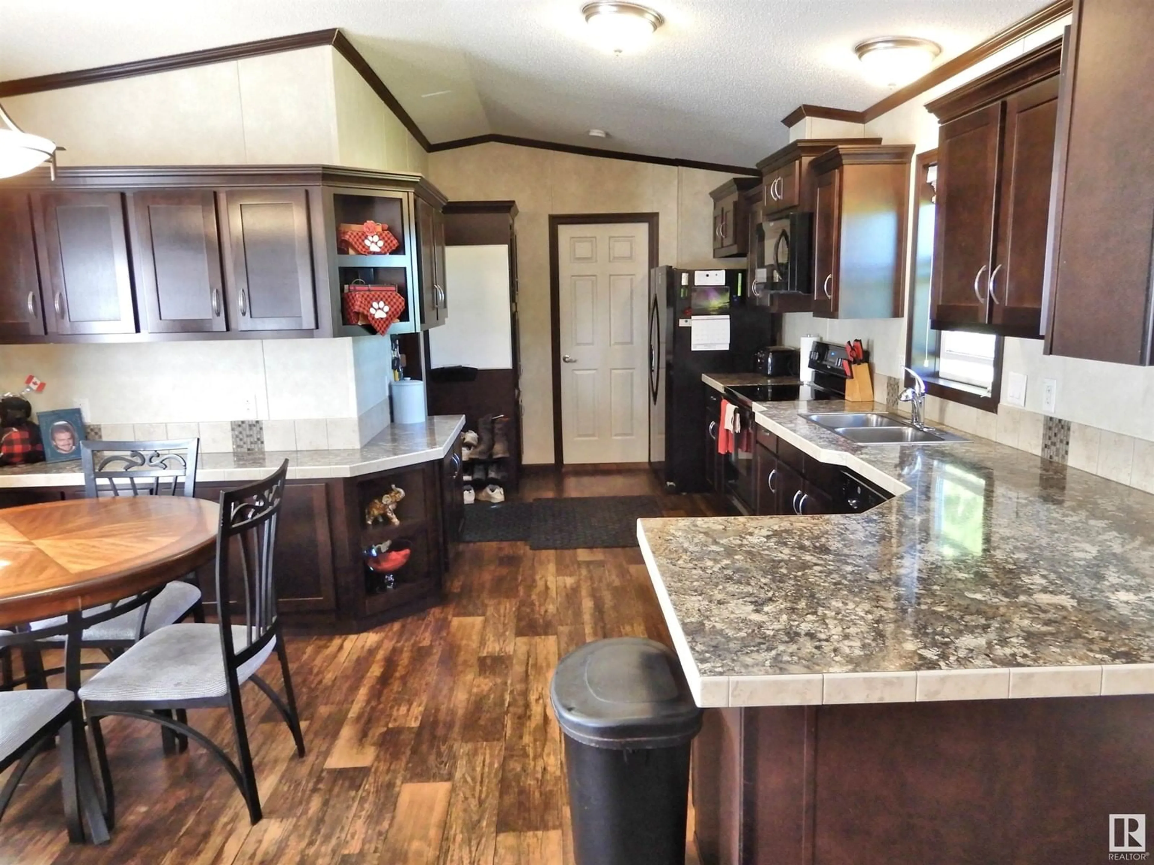 Open concept kitchen, wood/laminate floor for 58518 RGE RD 60, Rural Barrhead County Alberta T7N1N3