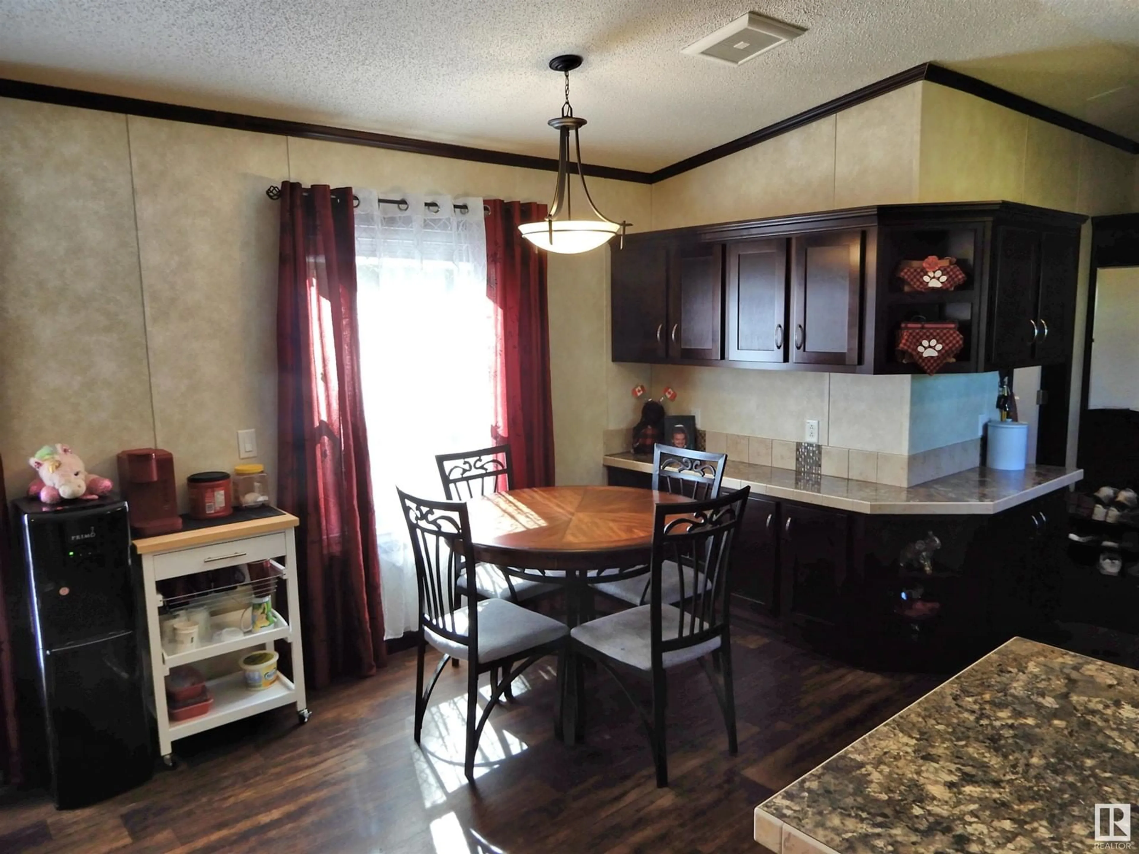 Open concept kitchen, wood/laminate floor for 58518 RGE RD 60, Rural Barrhead County Alberta T7N1N3