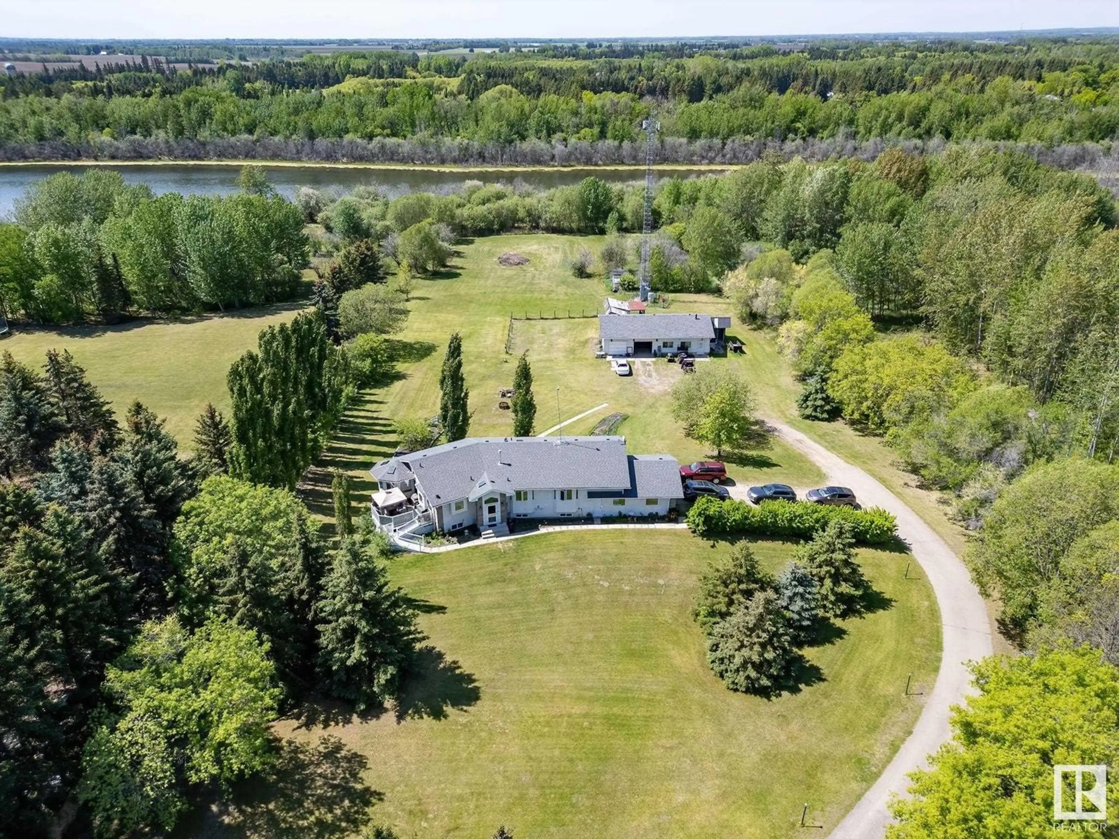A pic from outside/outdoor area/front of a property/back of a property/a pic from drone, water/lake/river/ocean view for 22 - 52212 RGE ROAD 274, Rural Parkland County Alberta T7X3T8