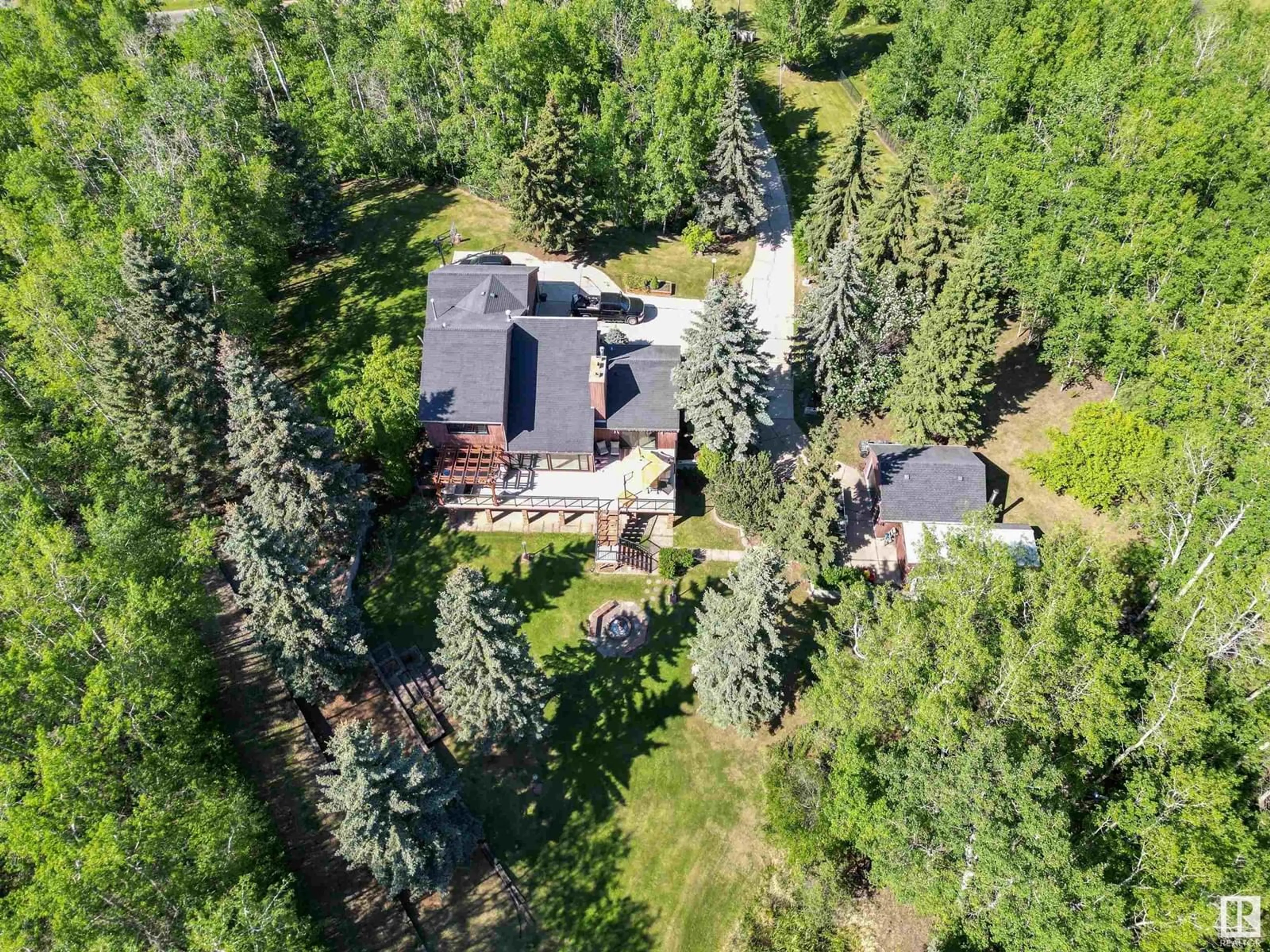 A pic from outside/outdoor area/front of a property/back of a property/a pic from drone, forest/trees view for 254 52152 RGE ROAD 225, Rural Strathcona County Alberta T8C1C6