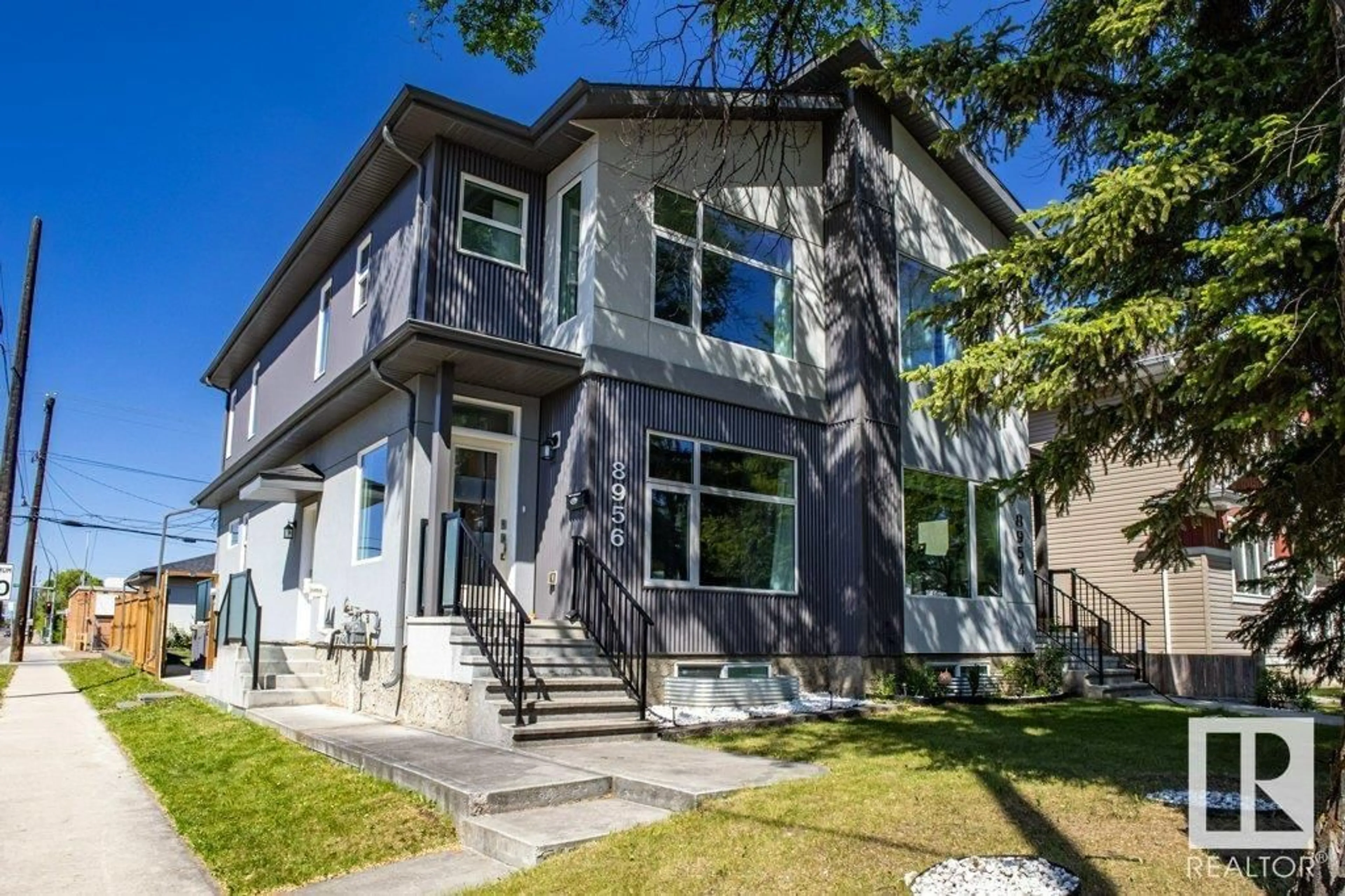 Home with vinyl exterior material, street for 8956 81 AV, Edmonton Alberta T6C0W8