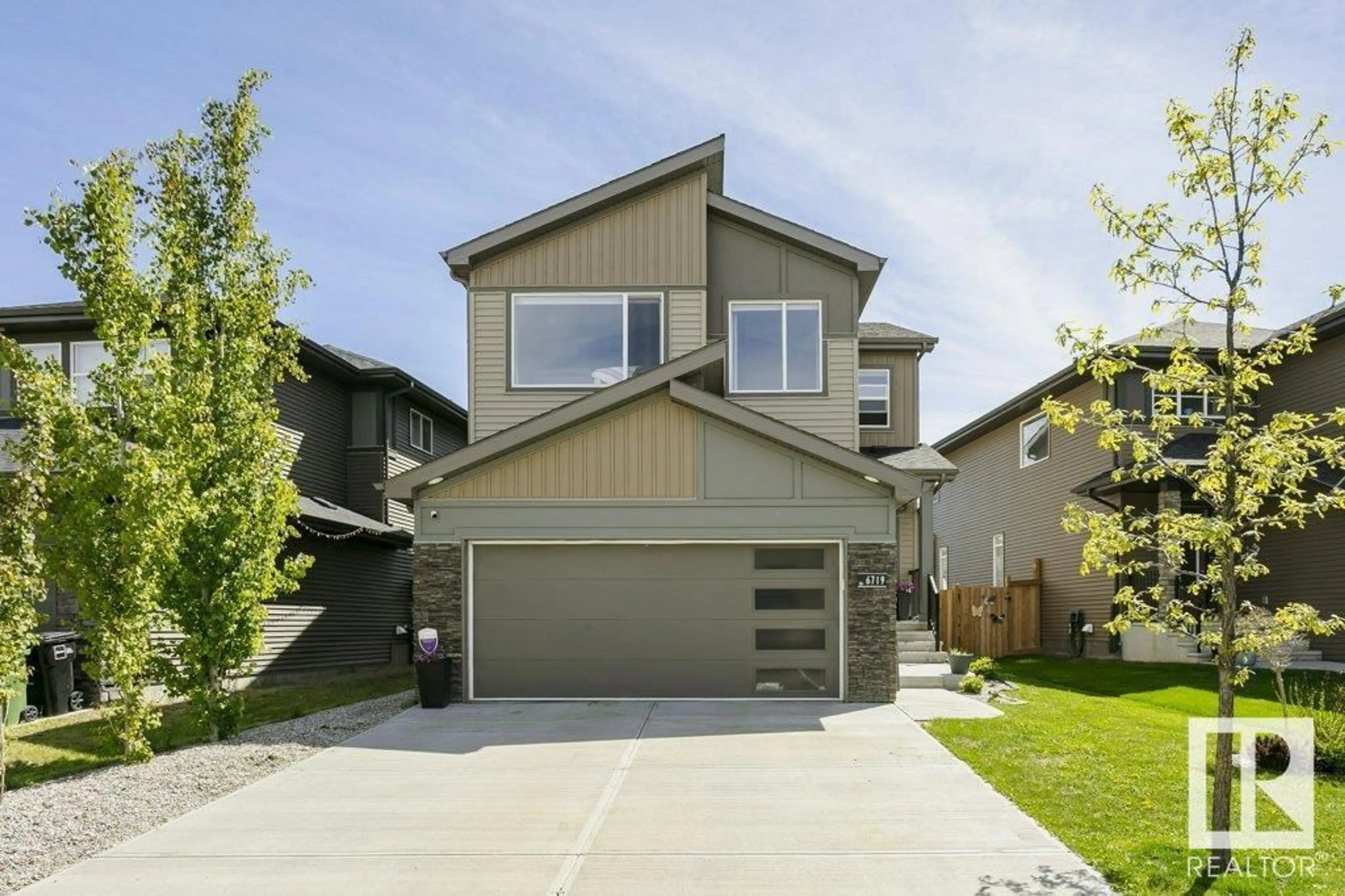 Home with vinyl exterior material, street for 6719 CRAWFORD WY, Edmonton Alberta T6W4L7