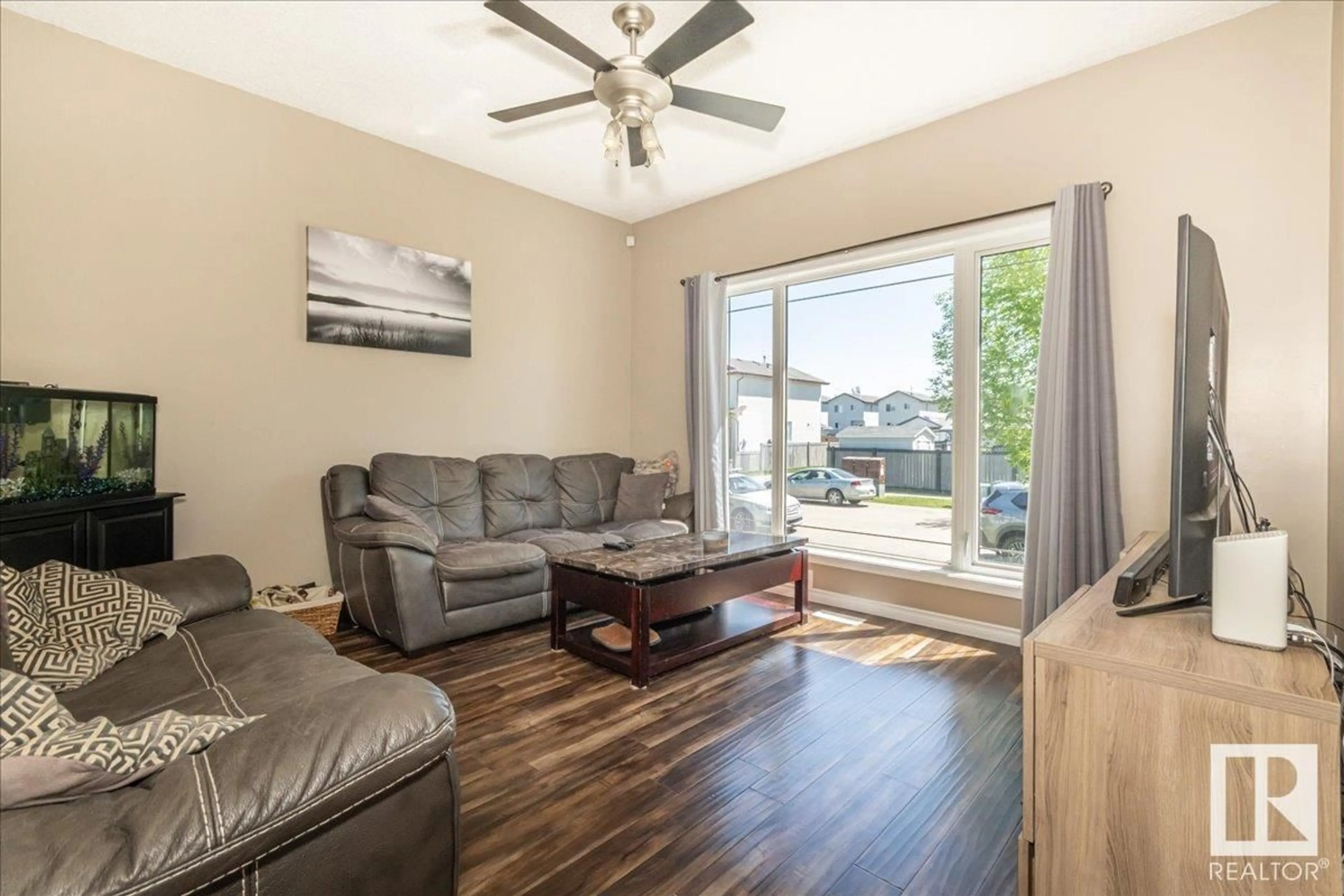 Living room with furniture, wood/laminate floor for 26 BIRCHGLEN CR, Leduc Alberta T9E0C5