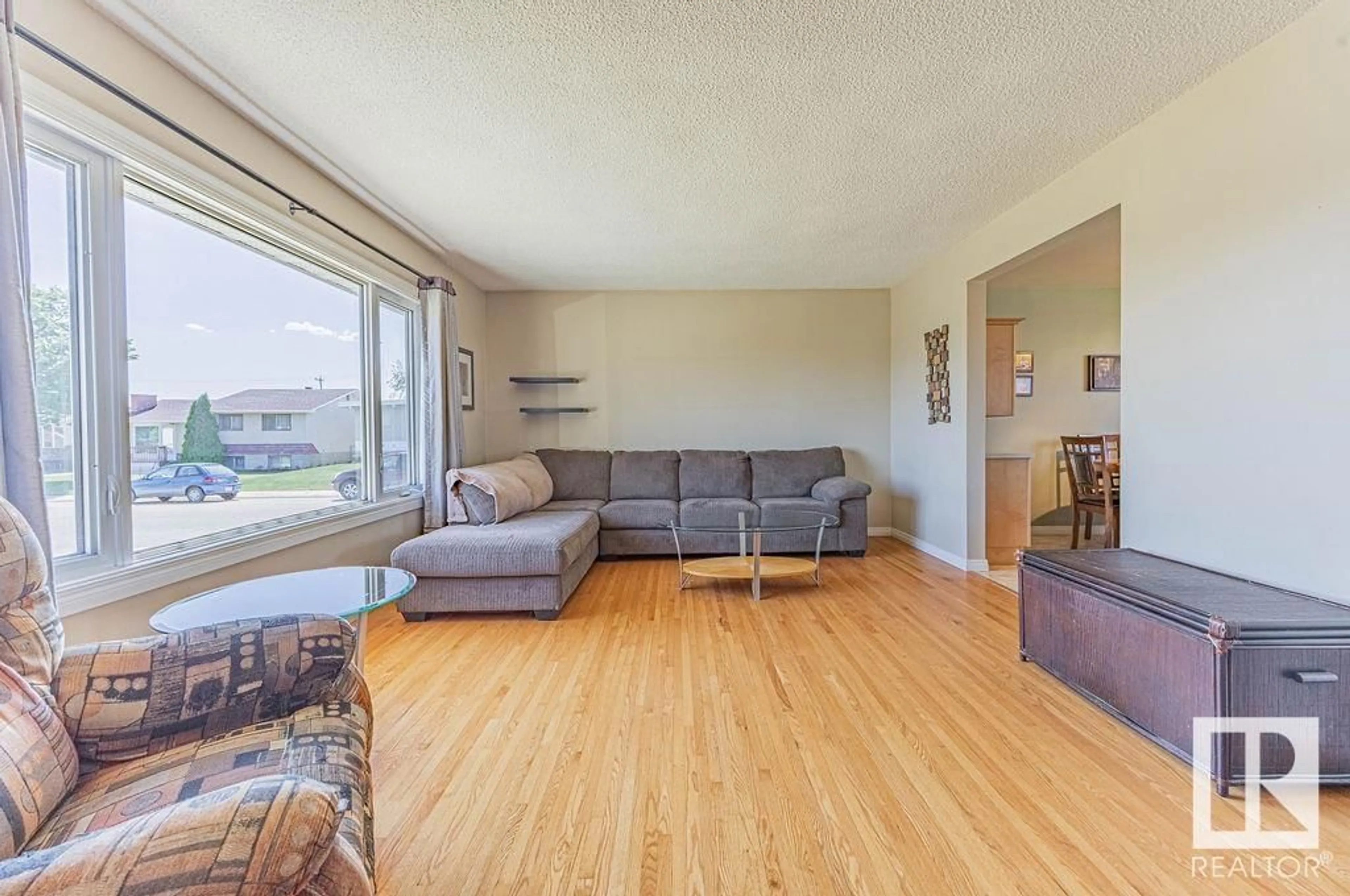 Living room with furniture, wood/laminate floor for 13435 81 ST, Edmonton Alberta T5C1N8