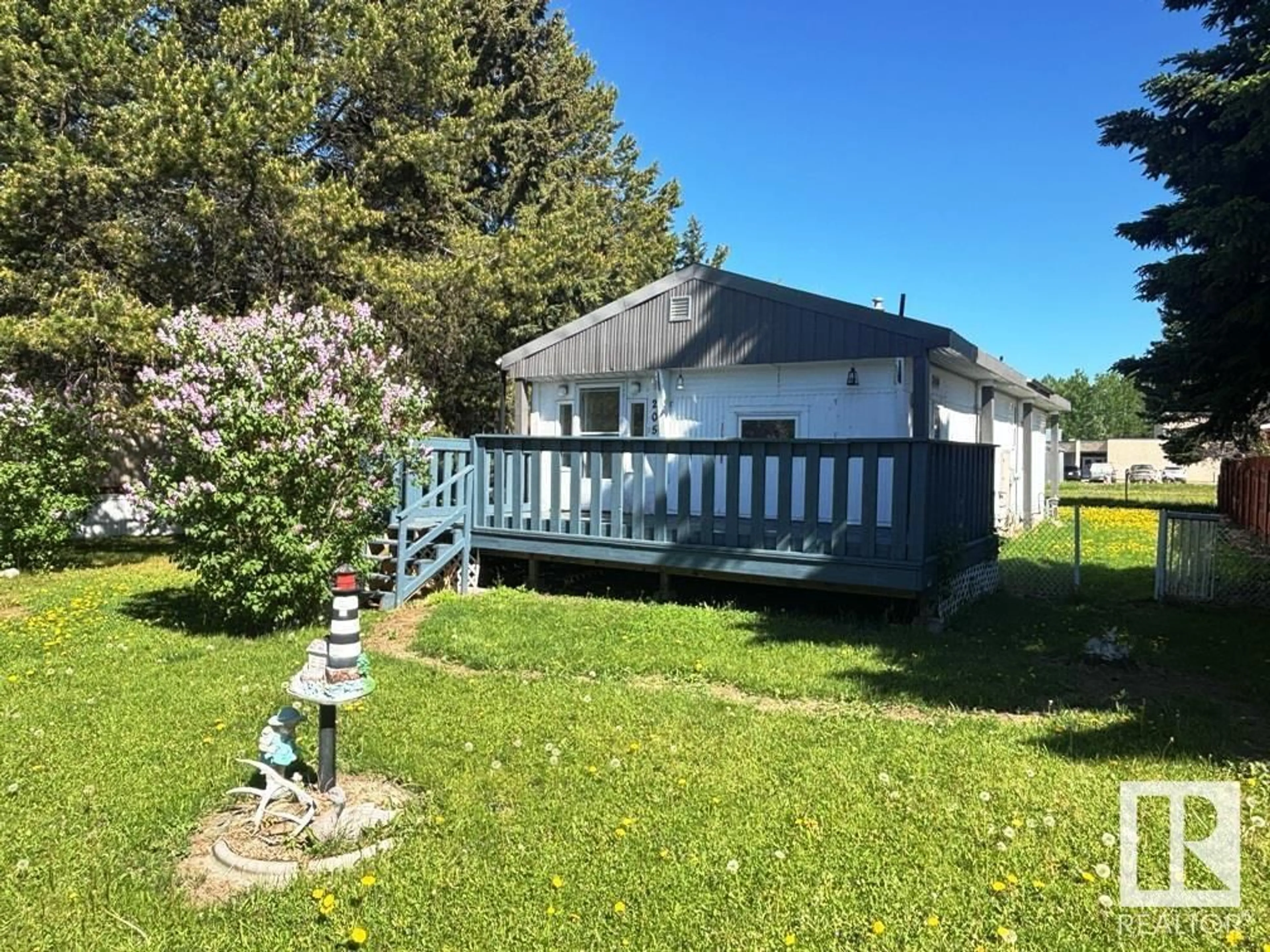 A pic from outside/outdoor area/front of a property/back of a property/a pic from drone, water/lake/river/ocean view for 205 MAPLE CRES, Breton Alberta T0C0P0