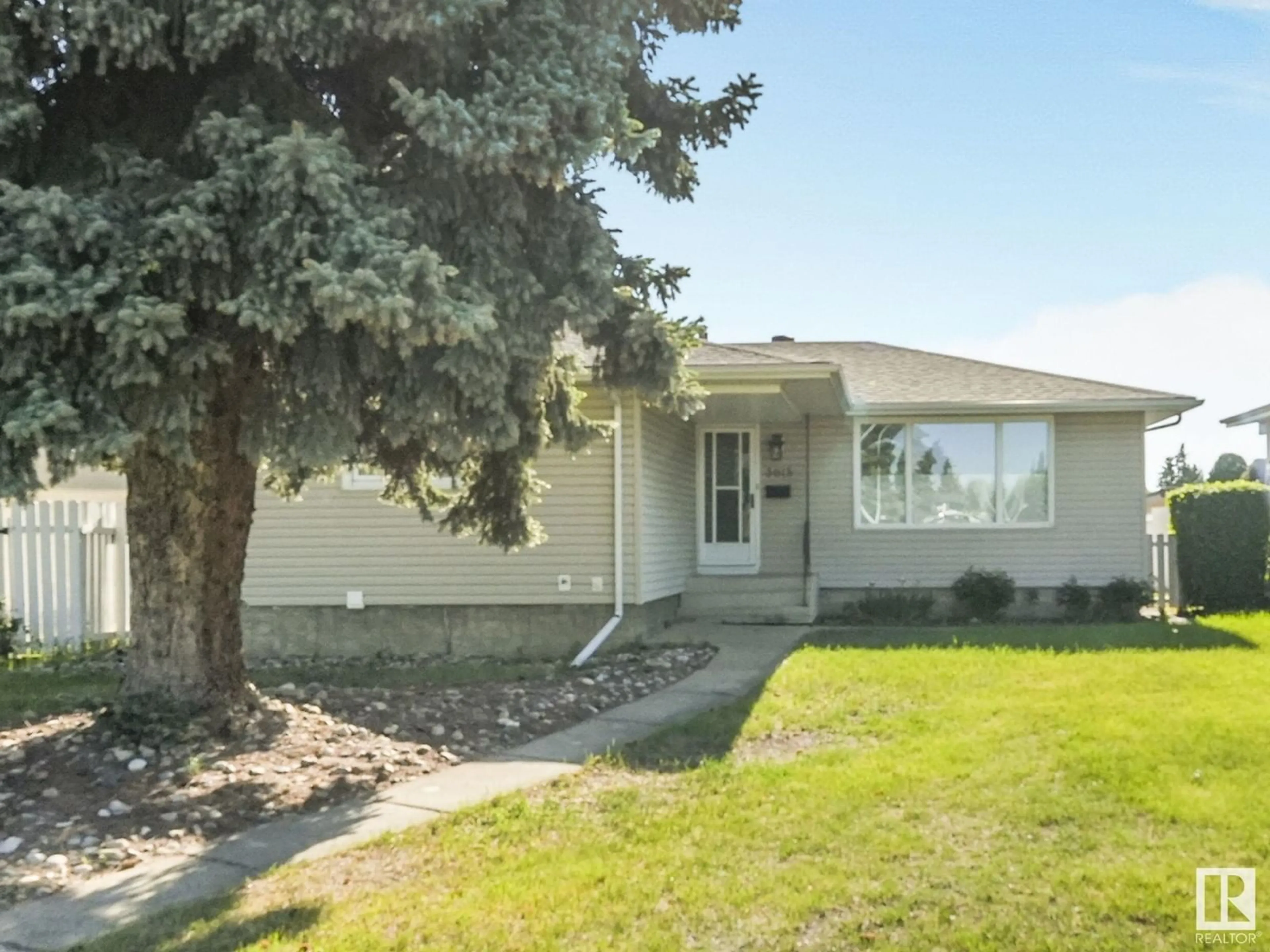 Home with vinyl exterior material, street for 3615 109 ST, Edmonton Alberta T6J1C2