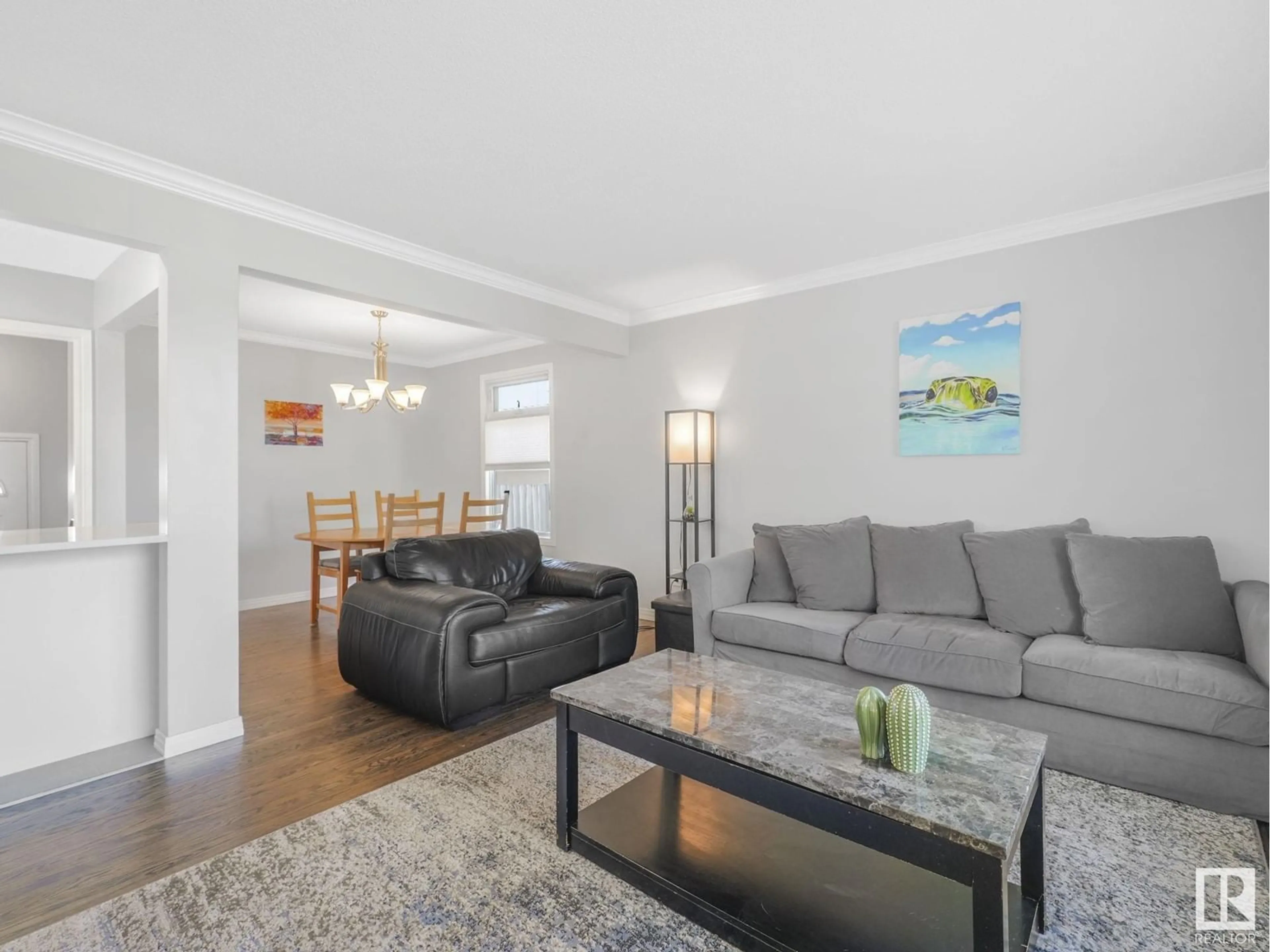 Living room with furniture, wood/laminate floor for 3615 109 ST, Edmonton Alberta T6J1C2