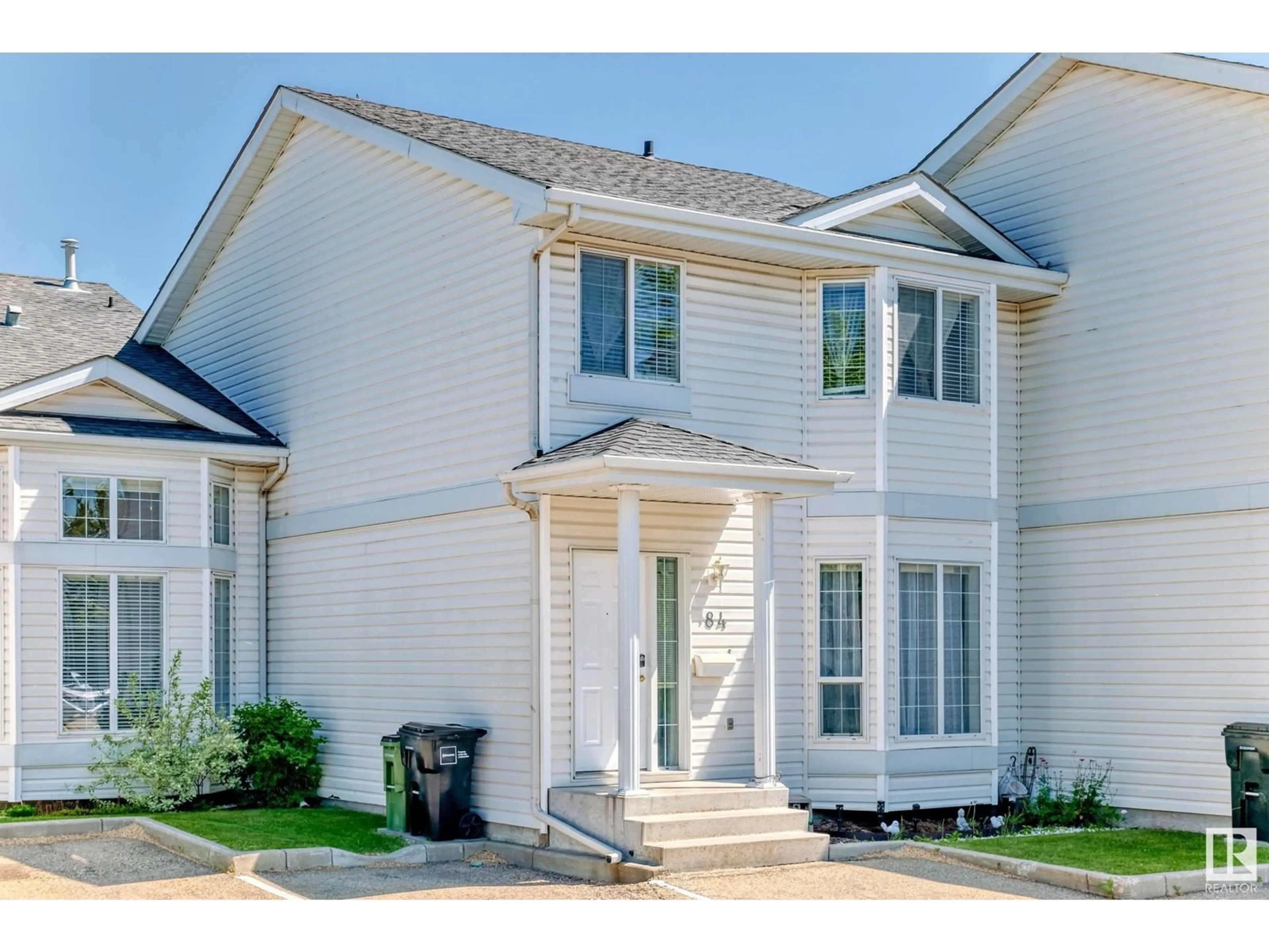 Home with vinyl exterior material, street for 84 - 3380 28A AV NW, Edmonton Alberta T6T1V4