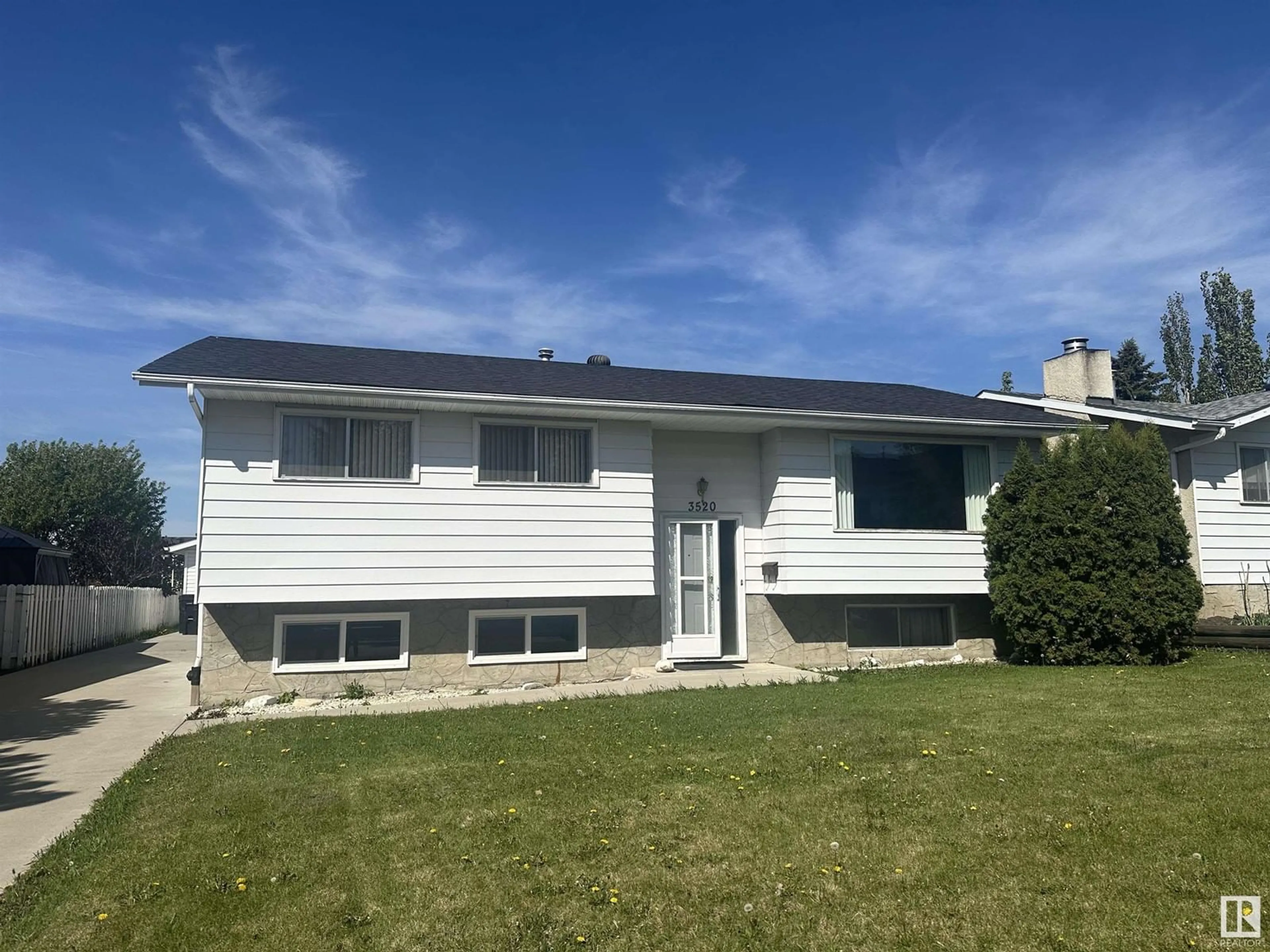 Home with vinyl exterior material, street for 3520 71 ST, Edmonton Alberta T6K0M7