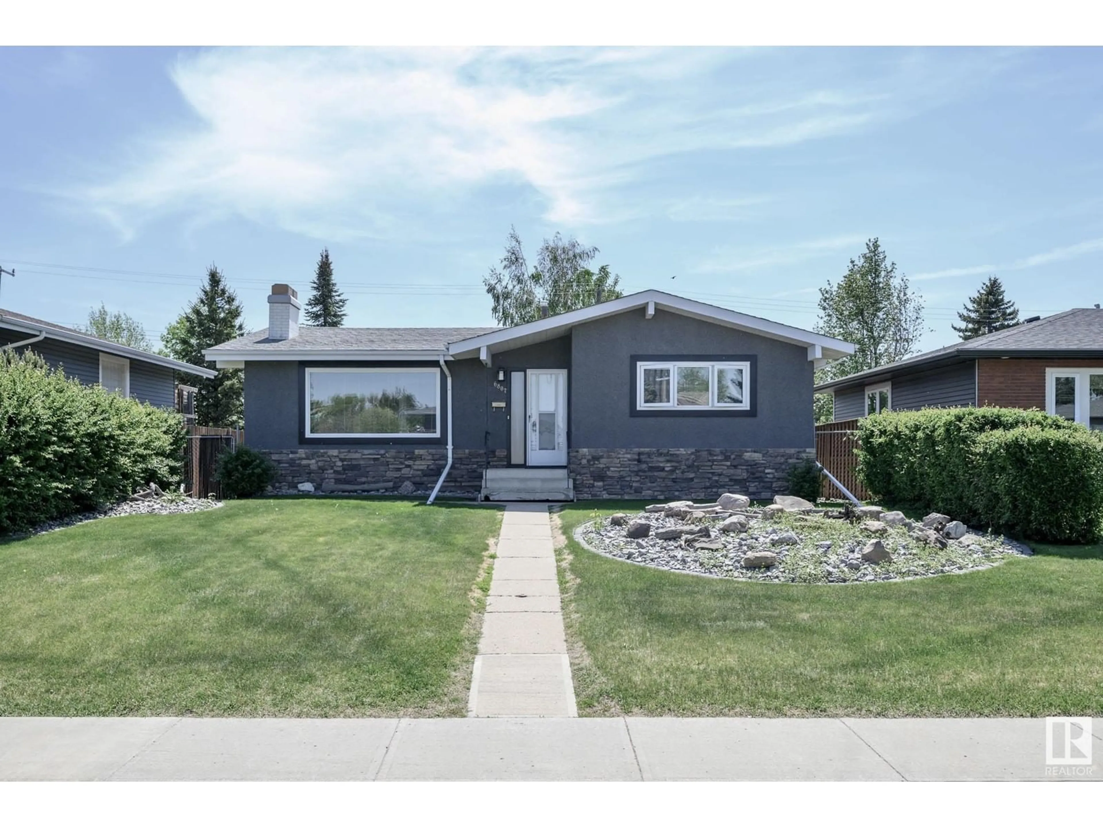 Home with vinyl exterior material, street for NW - 6807 98A AV, Edmonton Alberta T6A0B9
