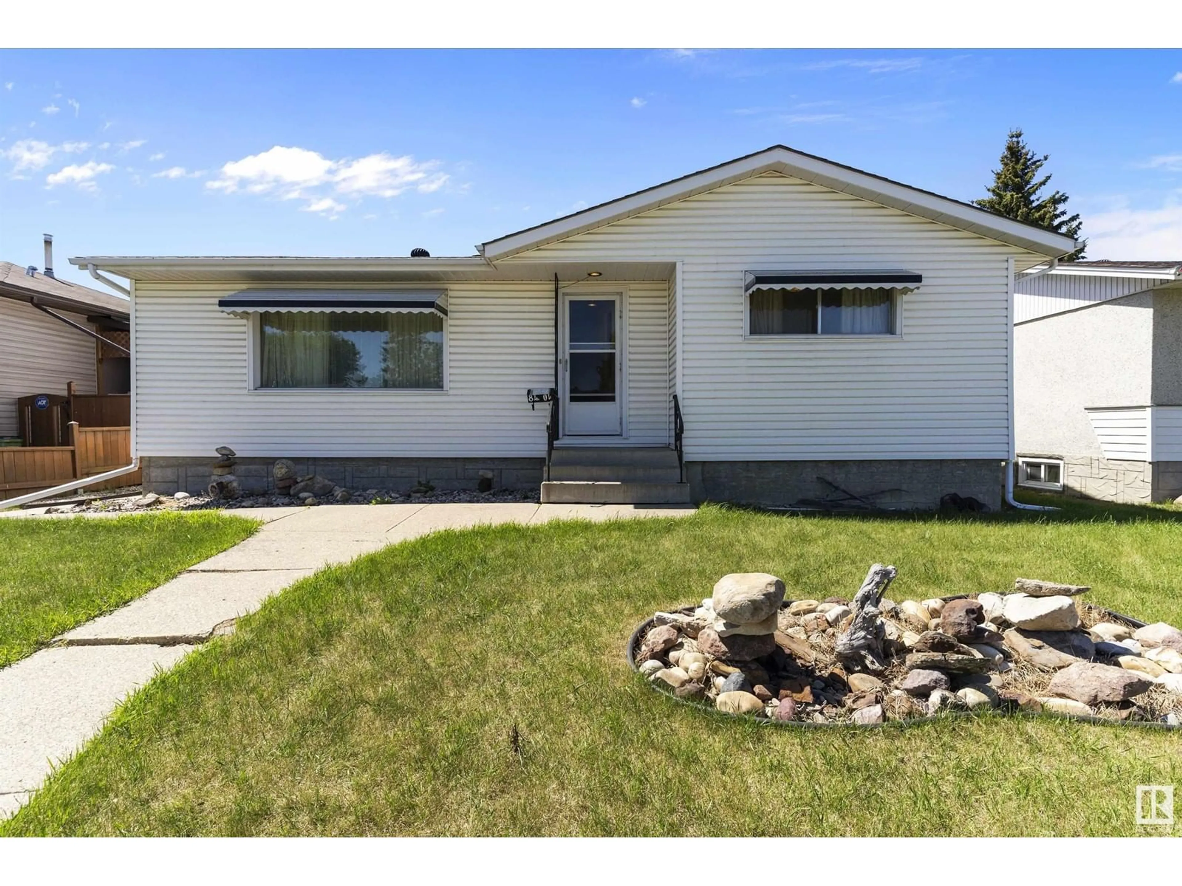 Home with vinyl exterior material, street for 8404 71 ST, Edmonton Alberta T6B1X4