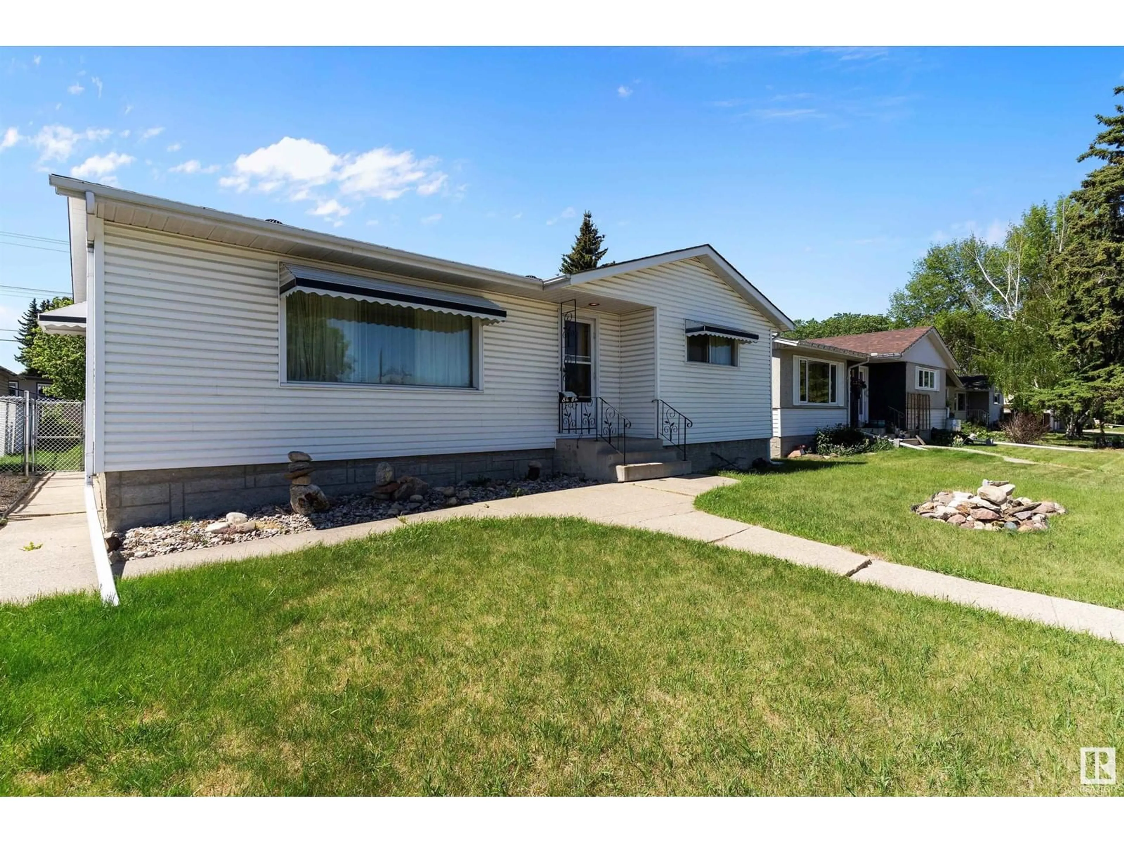 Home with vinyl exterior material, street for 8404 71 ST, Edmonton Alberta T6B1X4