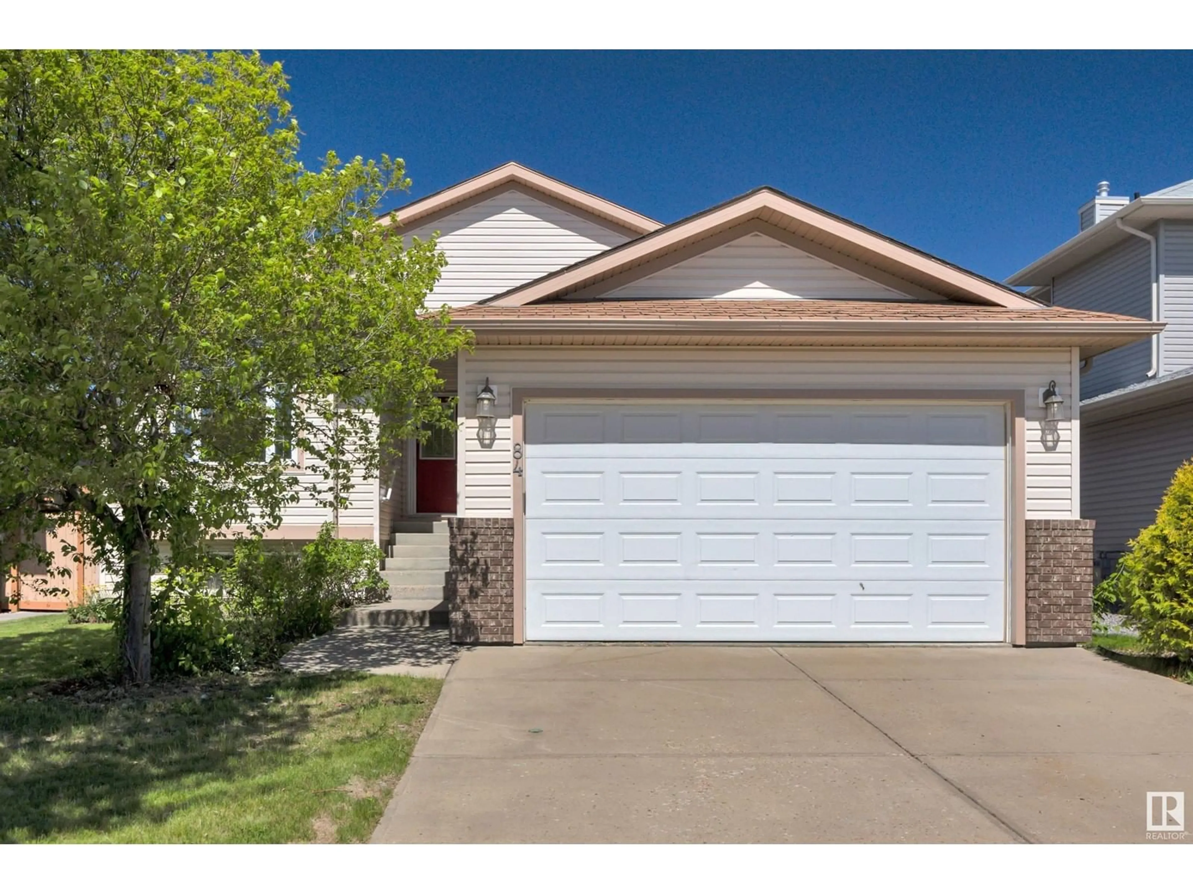 Home with vinyl exterior material, street for 84 WINDROSE DR, Leduc Alberta T9E8N3