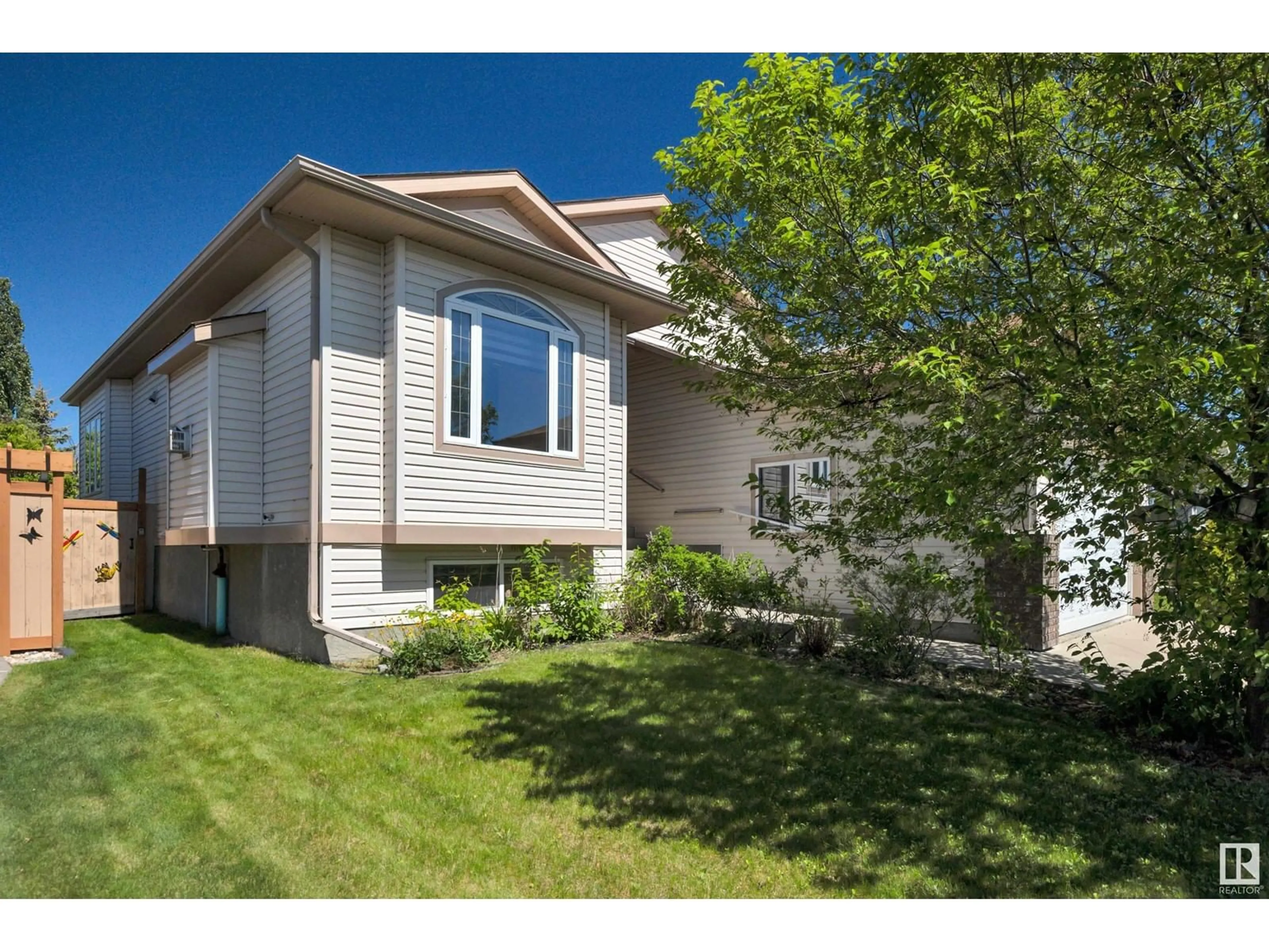 Home with vinyl exterior material, street for 84 WINDROSE DR, Leduc Alberta T9E8N3