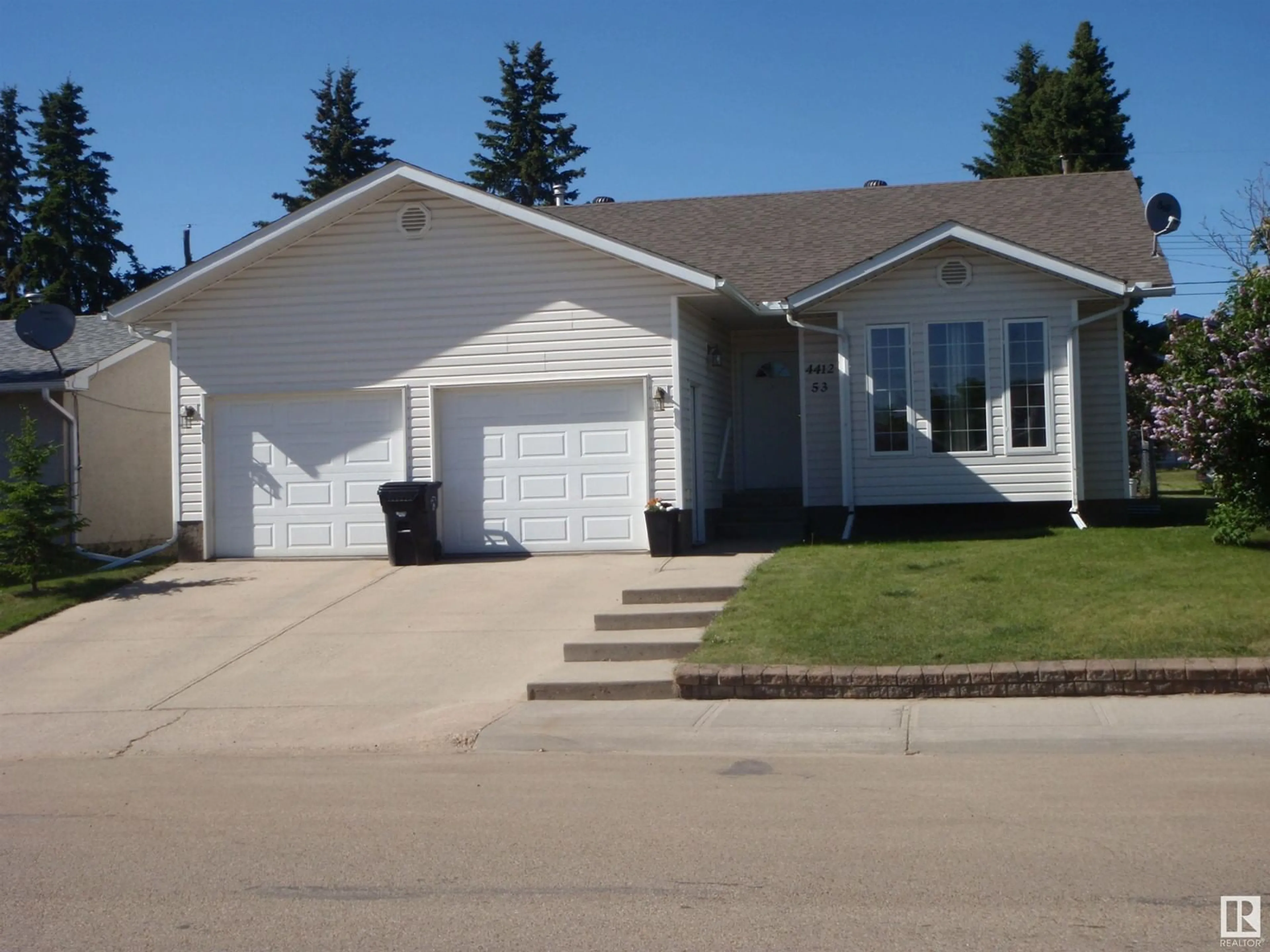 Home with vinyl exterior material, street for 4412 53 AV, Barrhead Alberta T7N1J8
