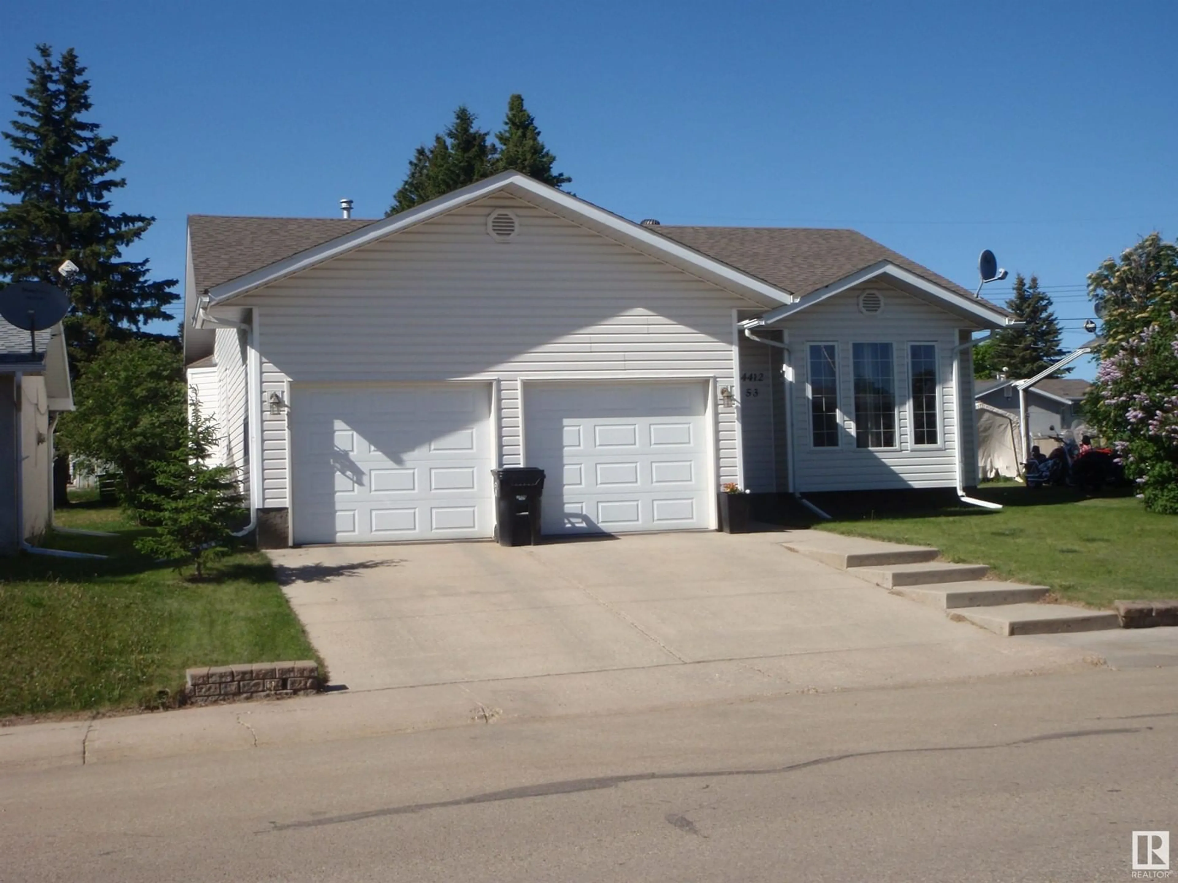 Home with vinyl exterior material, street for 4412 53 AV, Barrhead Alberta T7N1J8