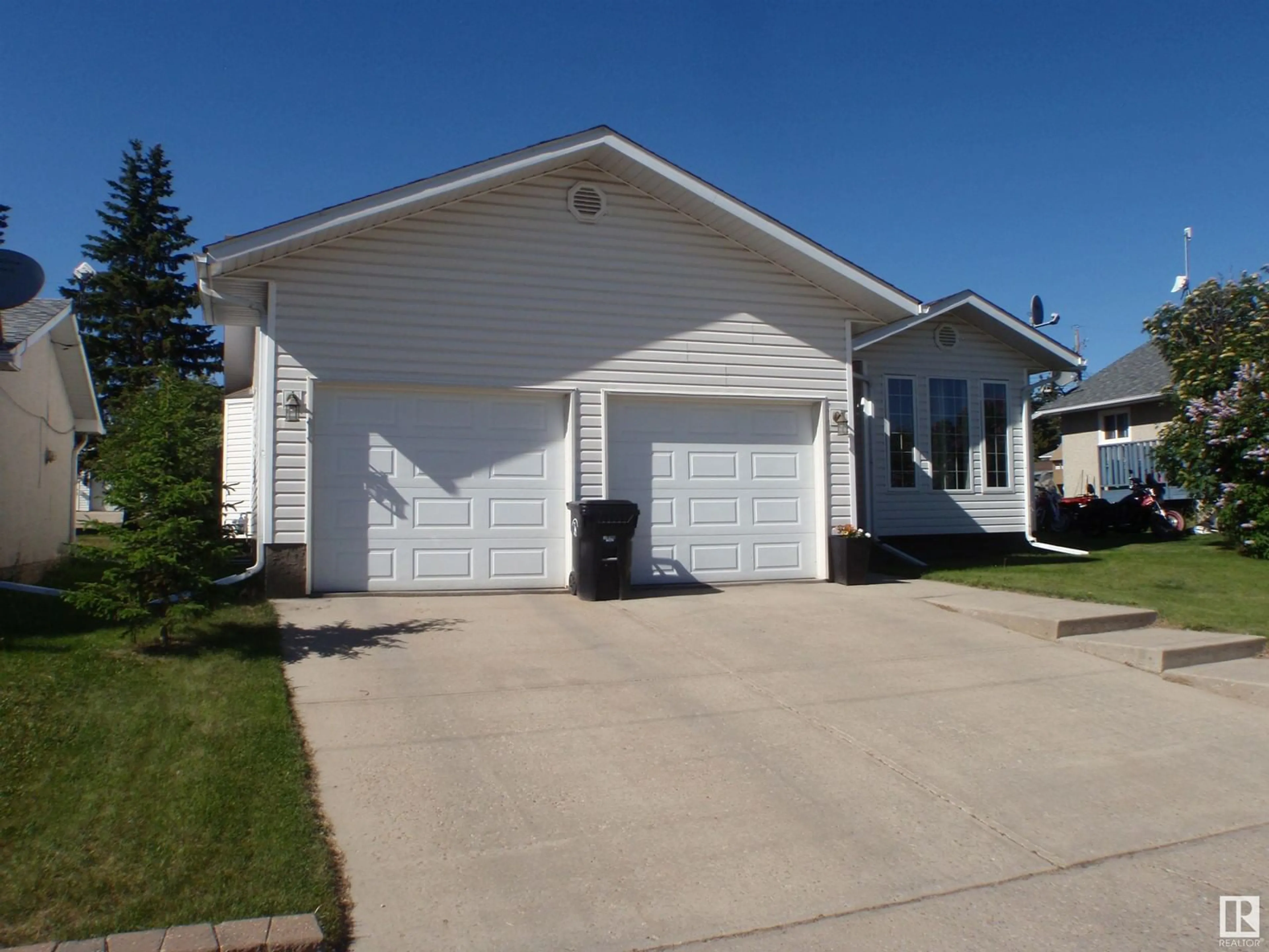 Home with vinyl exterior material, street for 4412 53 AV, Barrhead Alberta T7N1J8
