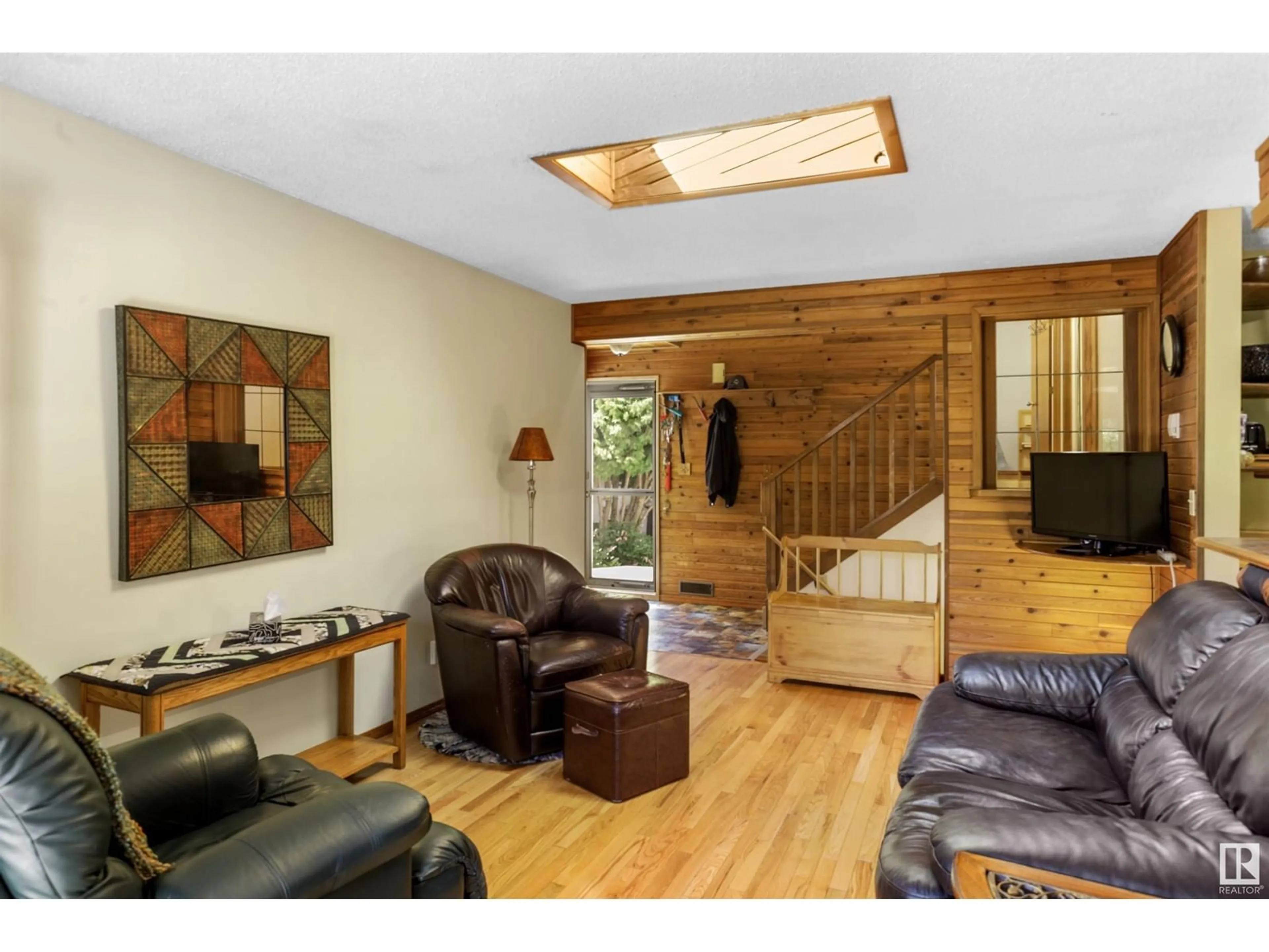 Living room with furniture, wood/laminate floor for 52 CHUNGO DR, Devon Alberta T9G1M7