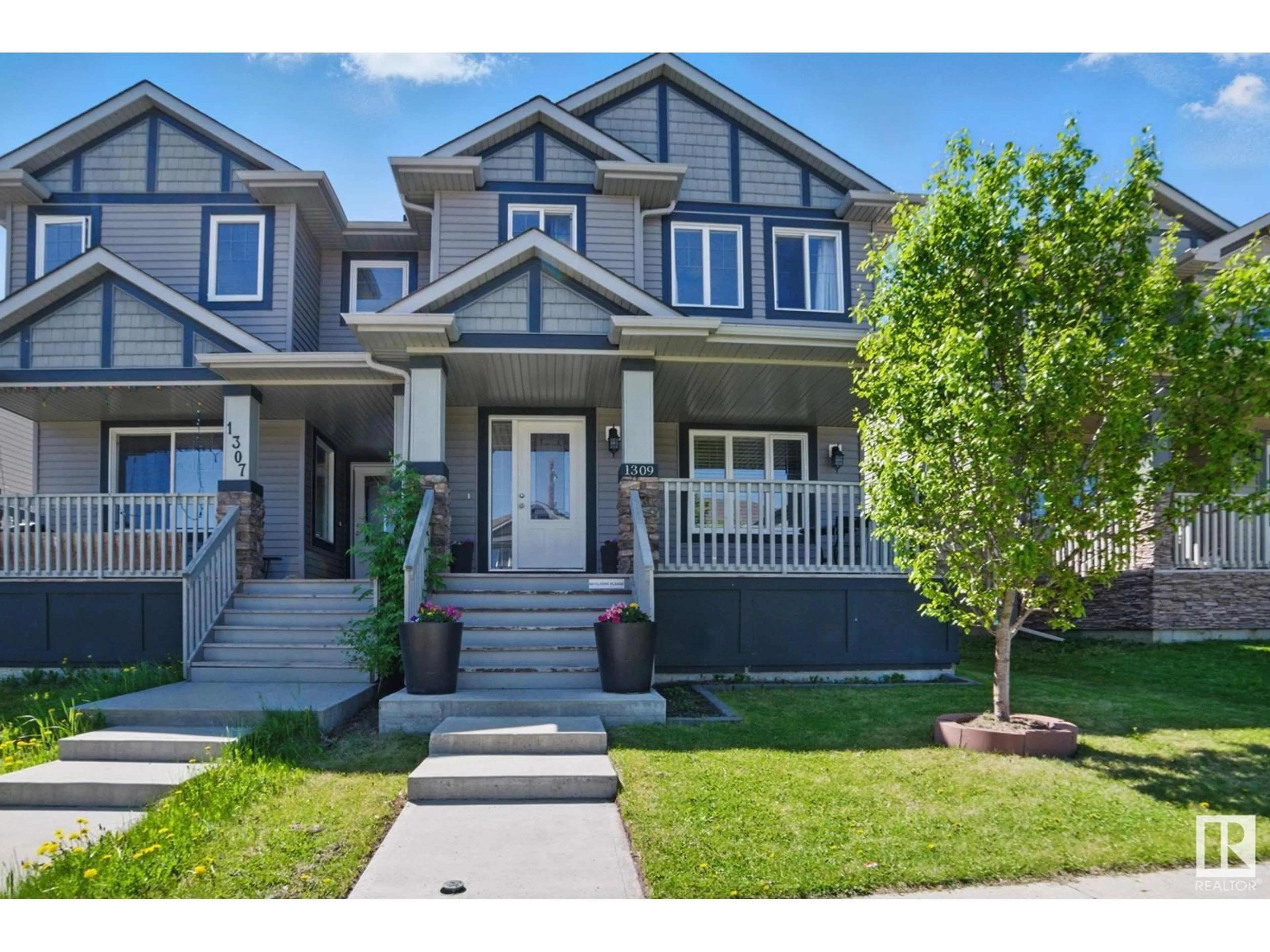 Home with vinyl exterior material, street for NW - 1309 30 AV, Edmonton Alberta T6T0V7