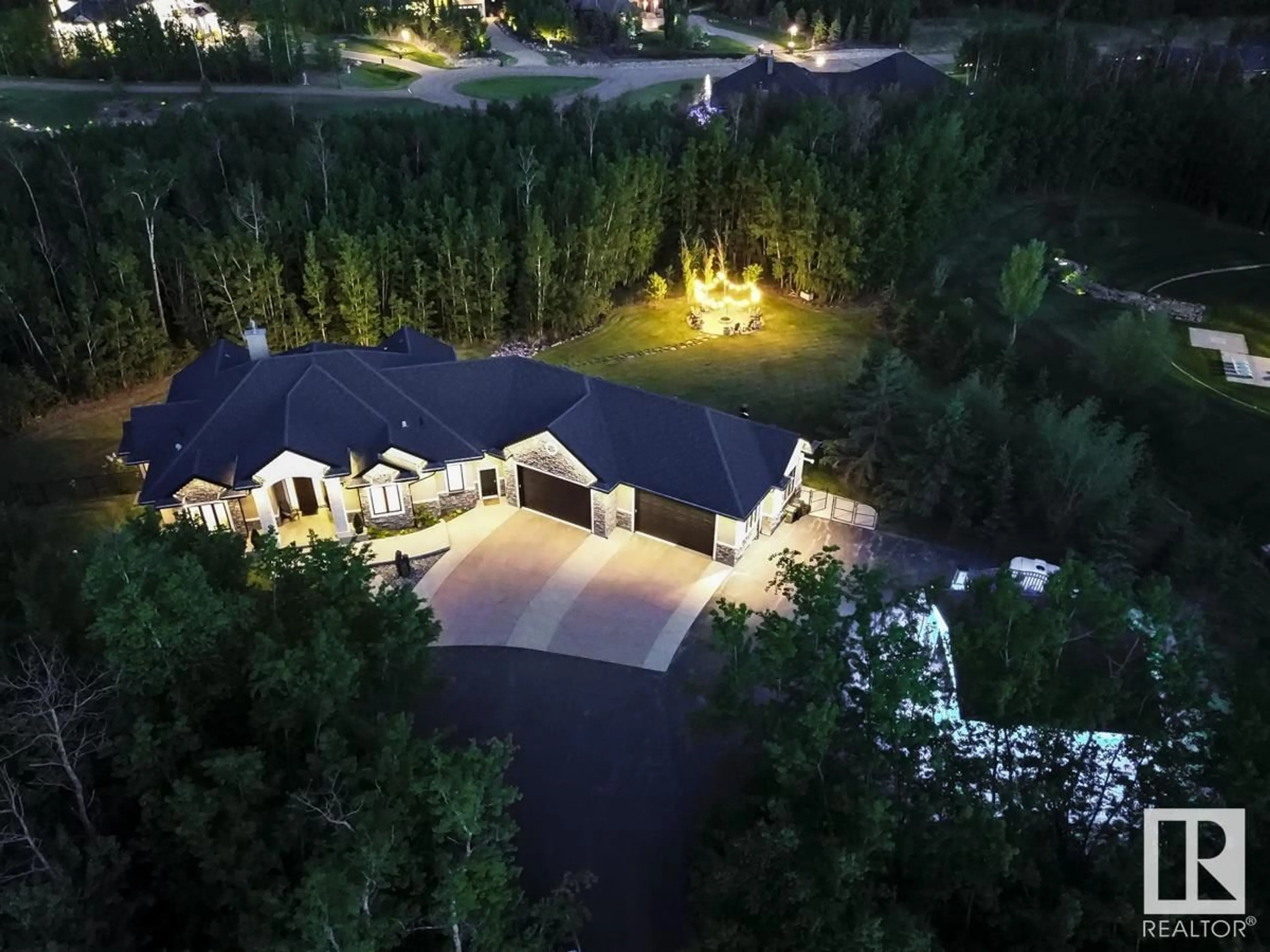 A pic from outside/outdoor area/front of a property/back of a property/a pic from drone, forest/trees view for 217 - 52105 RGE ROAD 225, Rural Strathcona County Alberta T8C1C2