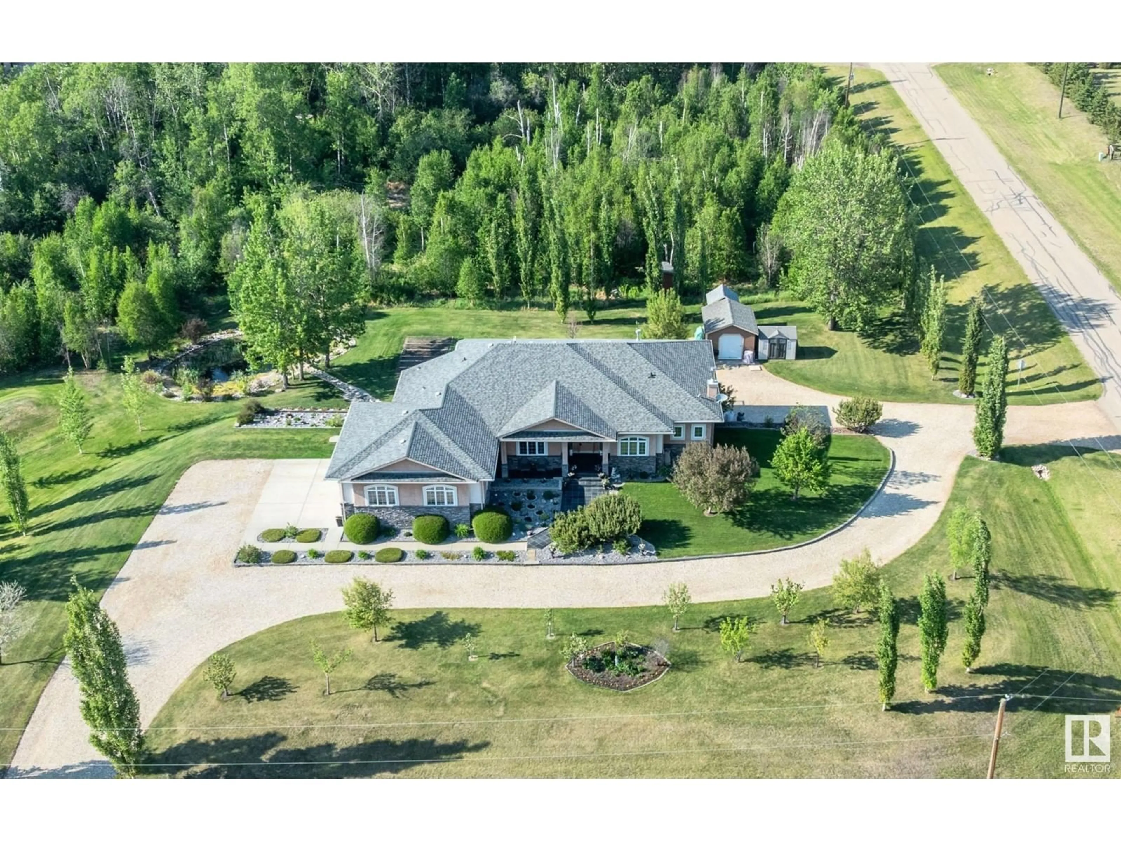 A pic from outside/outdoor area/front of a property/back of a property/a pic from drone, mountain view for 50446 - 40 RANGE ROAD 232, Rural Leduc County Alberta T4X0L1