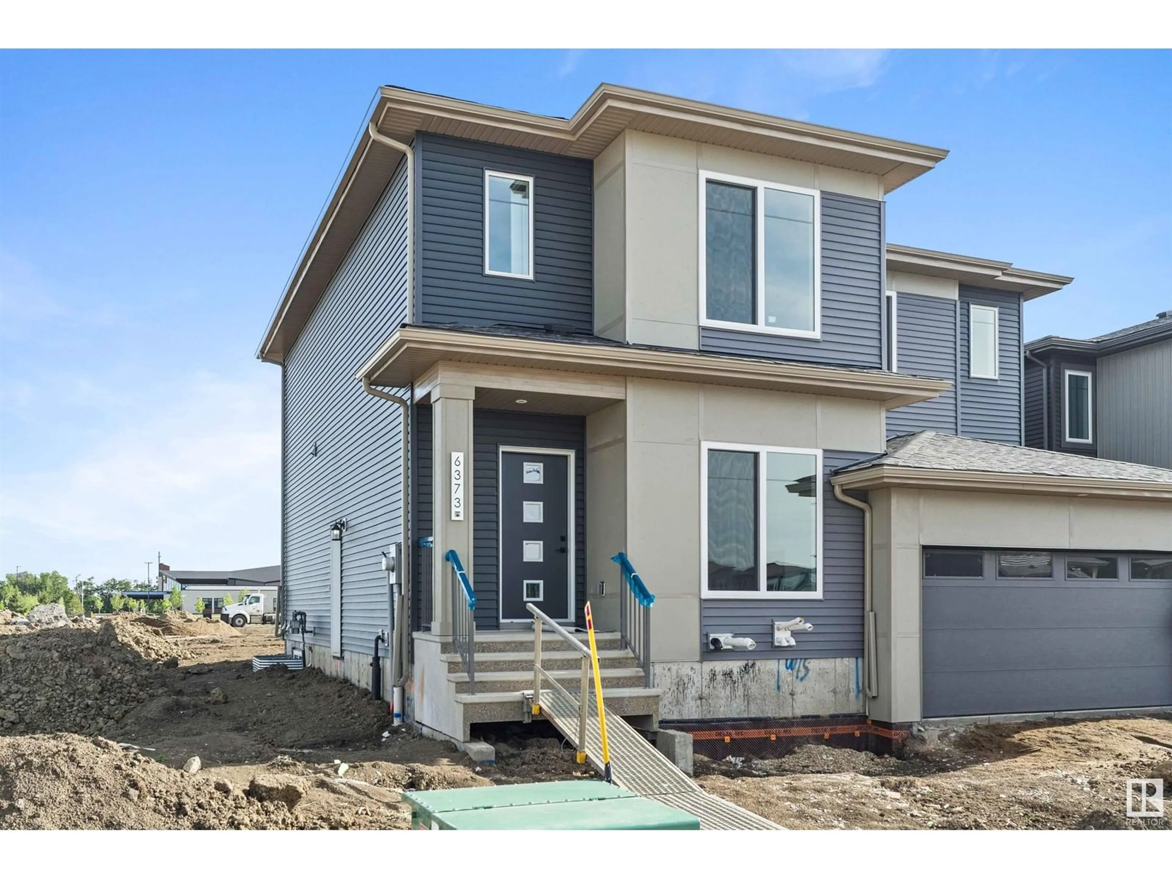 Home with vinyl exterior material, street for 6373 KING WD, Edmonton Alberta T6W5J3