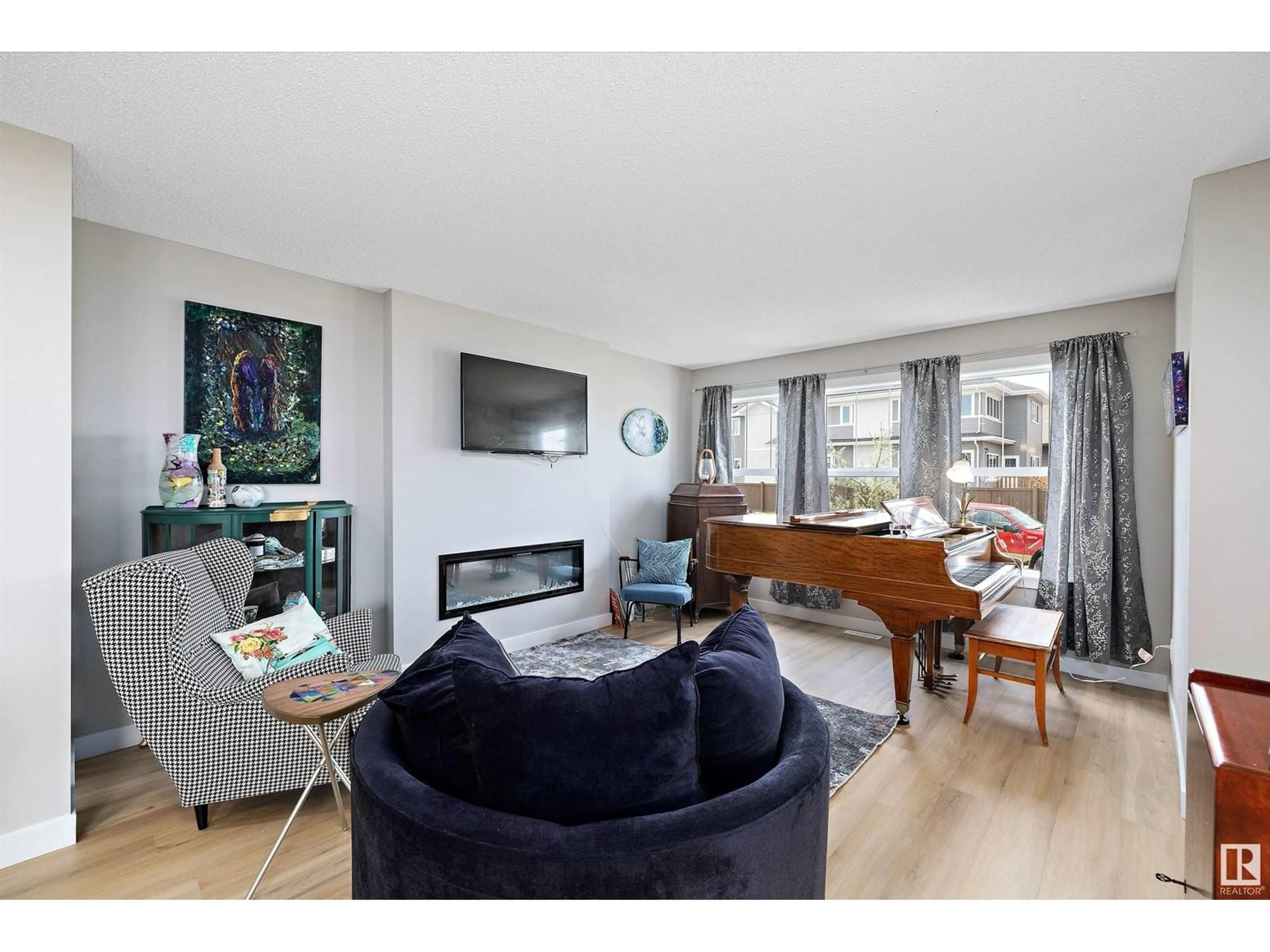 Living room with furniture, wood/laminate floor for 98 PENN PL, Spruce Grove Alberta T7Z2W7