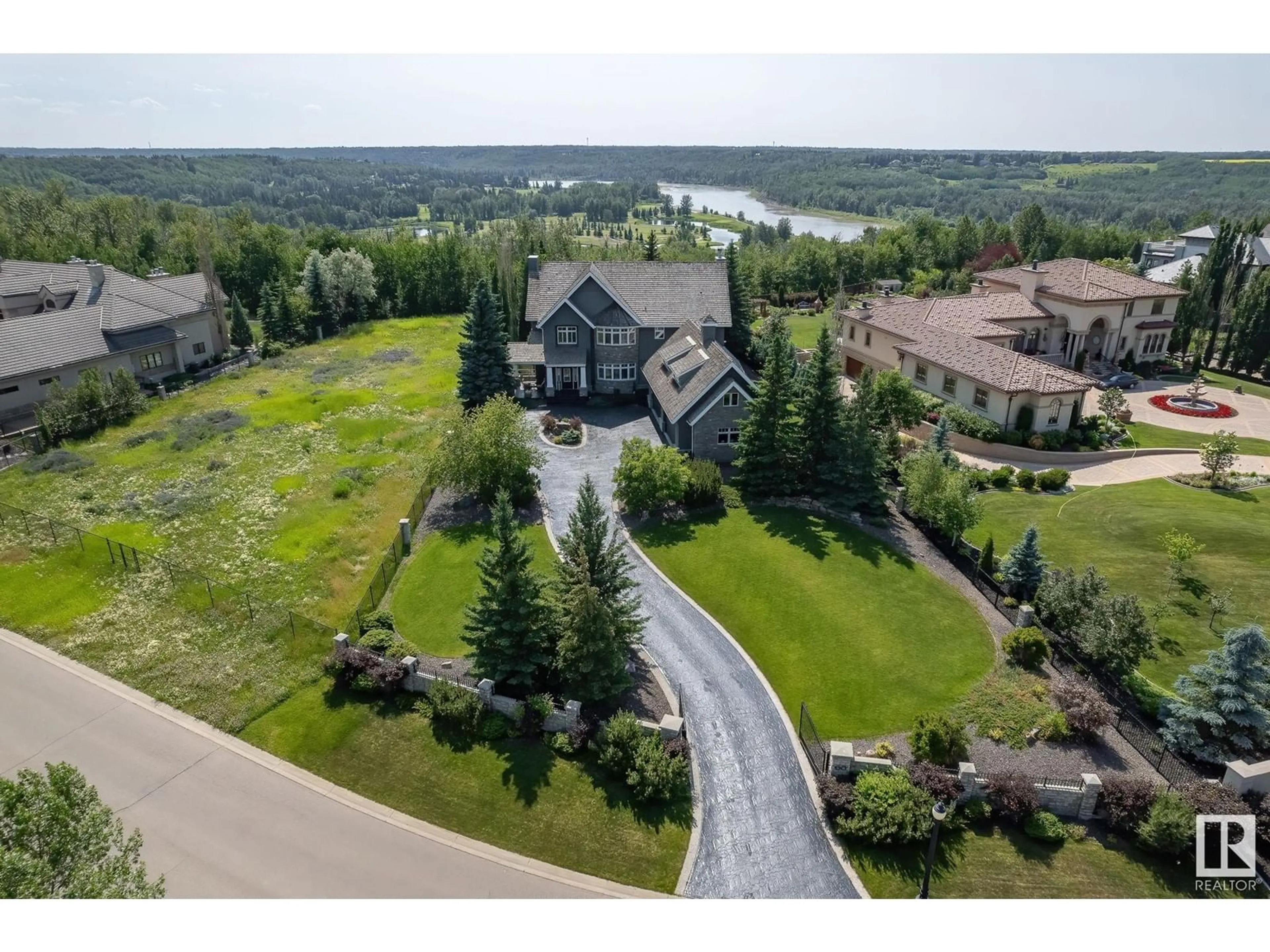 A pic from outside/outdoor area/front of a property/back of a property/a pic from drone, water/lake/river/ocean view for 60 WINDERMERE DR, Edmonton Alberta T6W0S1