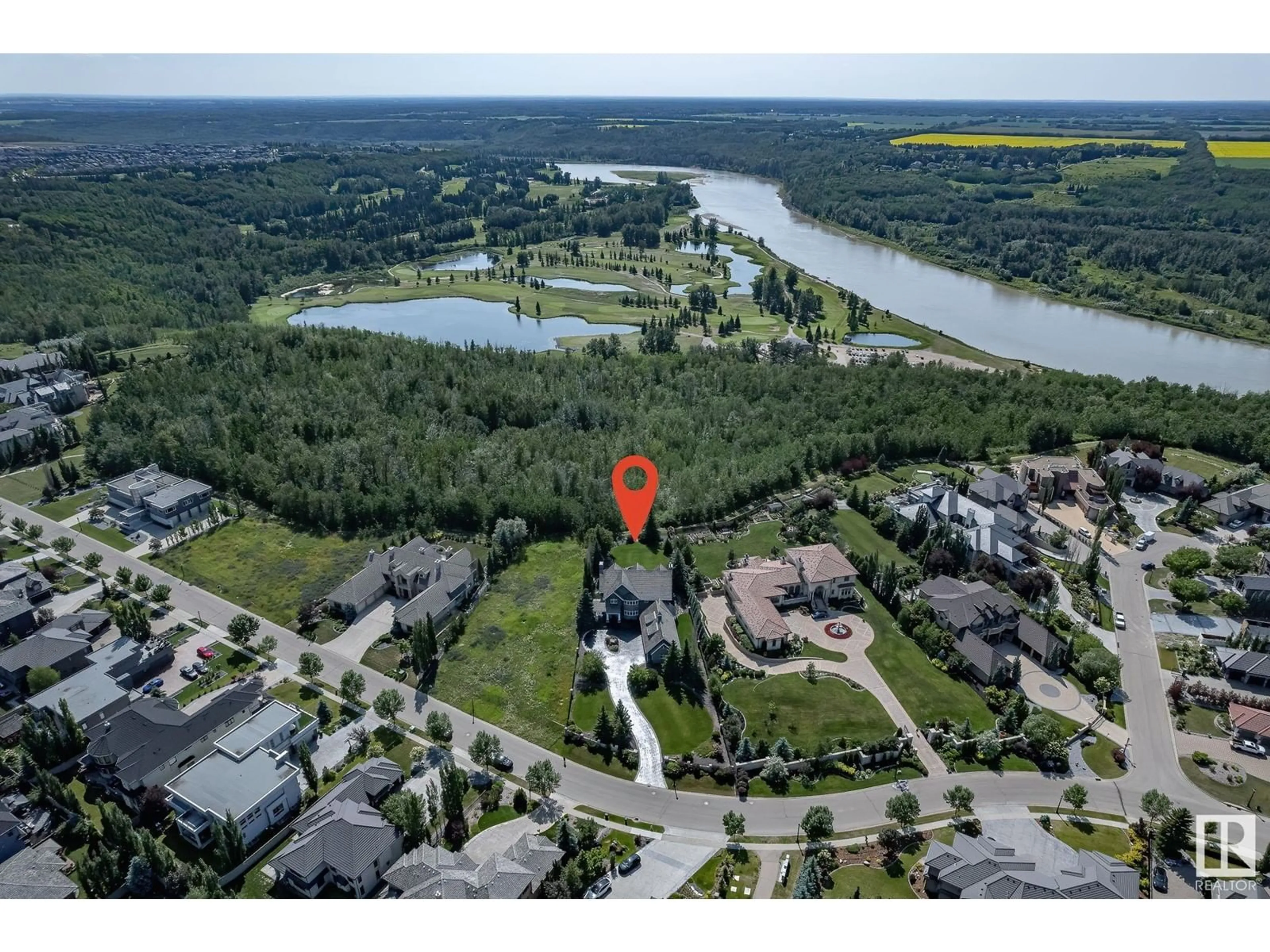 A pic from outside/outdoor area/front of a property/back of a property/a pic from drone, water/lake/river/ocean view for 60 WINDERMERE DR, Edmonton Alberta T6W0S1
