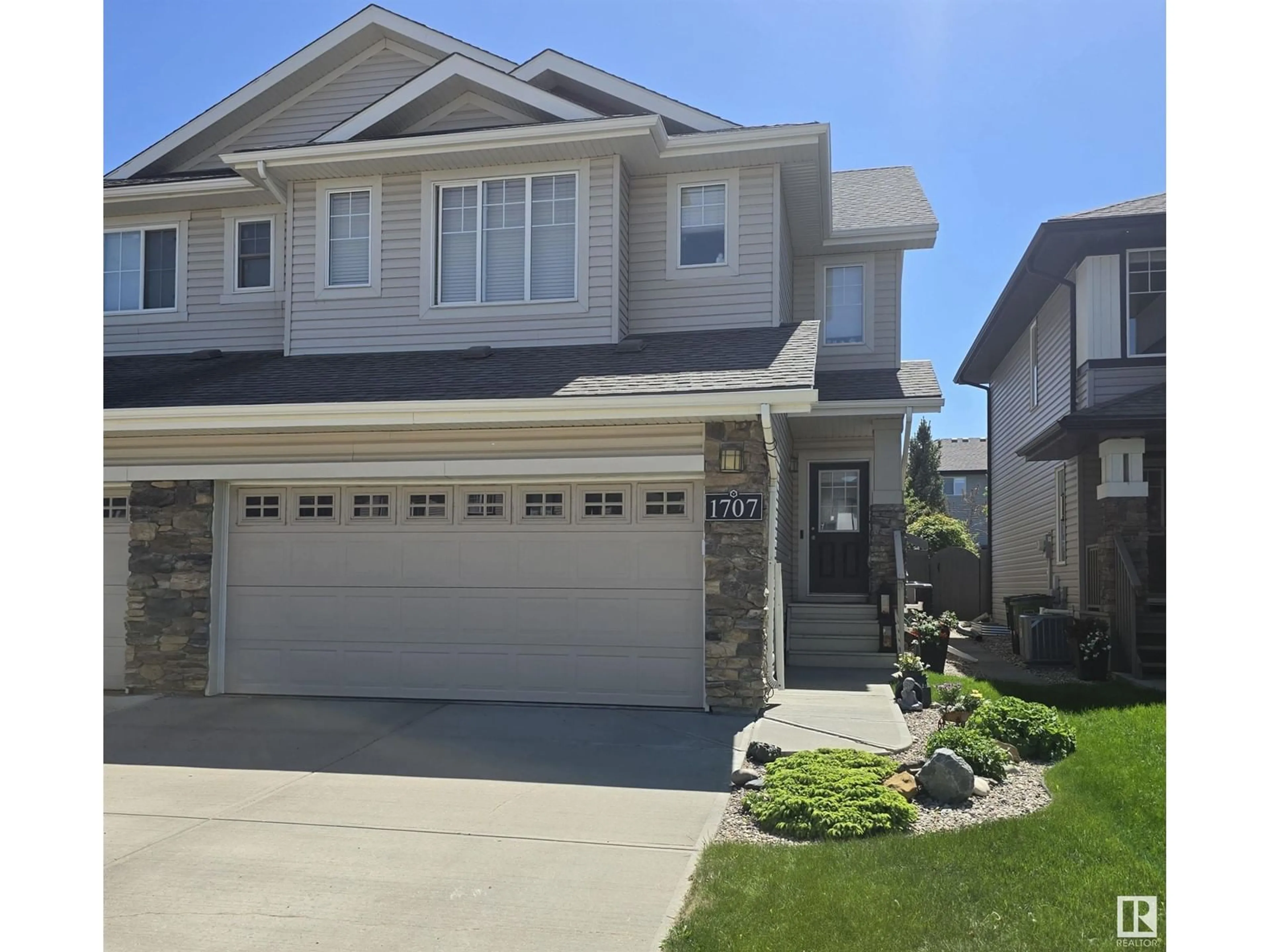 Home with vinyl exterior material, street for 1707 CUNNINGHAM WY, Edmonton Alberta T6W0W4